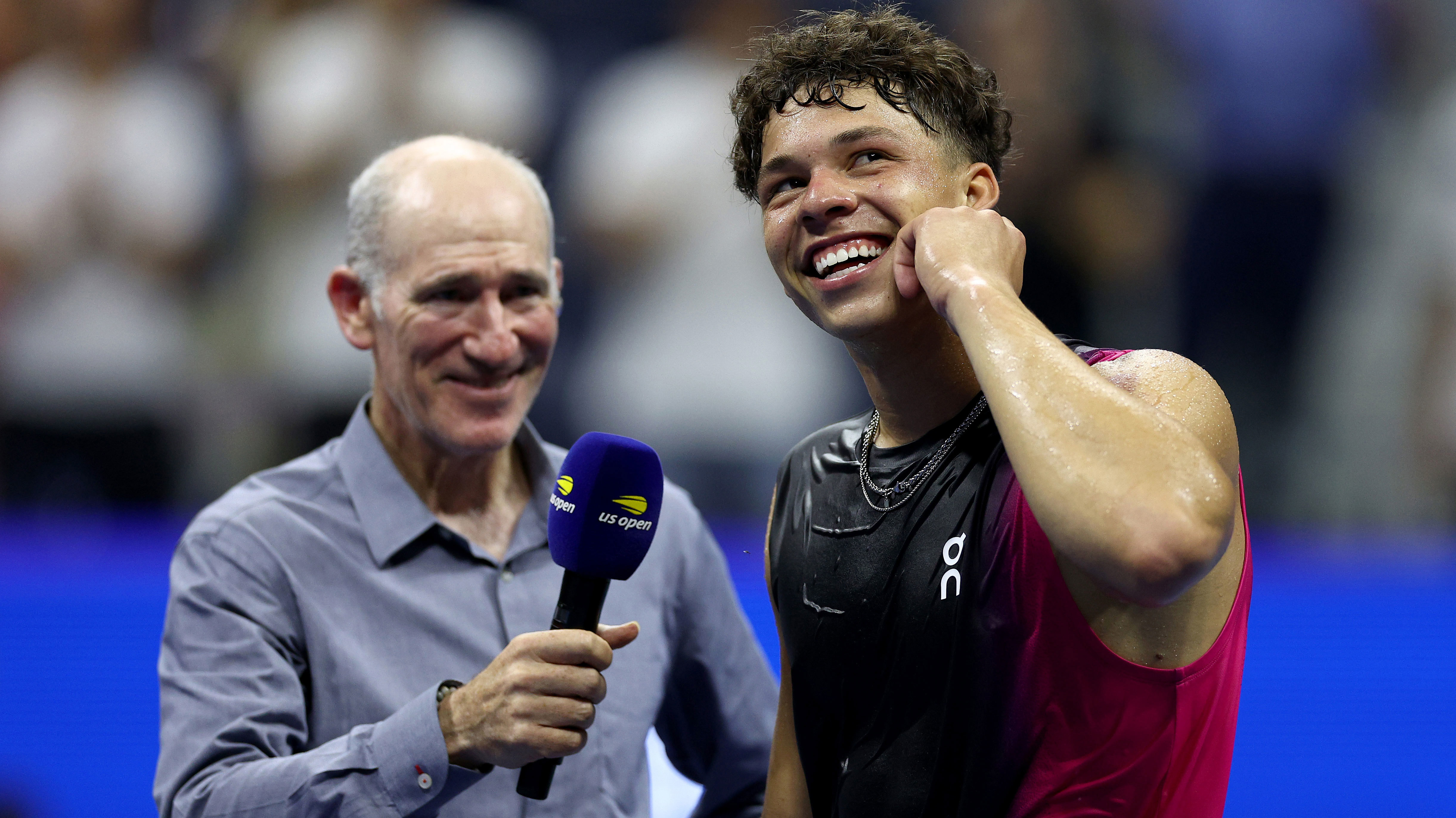 Ben Shelton laughs during an on court interview with Brad Gilbert after winning his US Open quarter final clash against Frances Tiafoe.