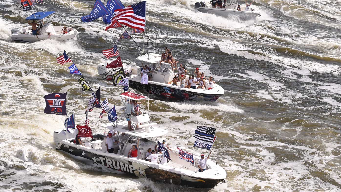 A flotilla of watercraft join a boat parade for President Donald Trump in Florida.