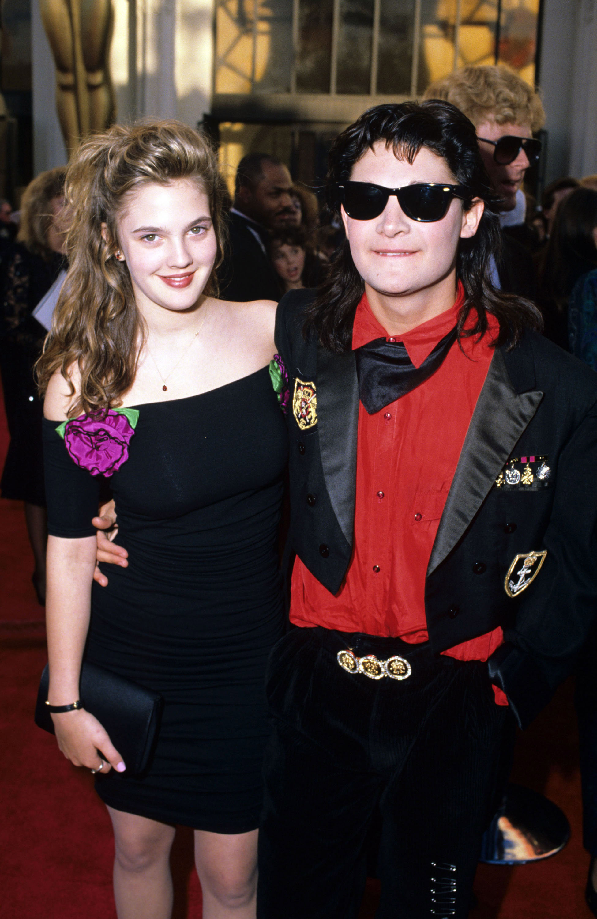 Drew Barrymore and Corey Feldman attend the 1989 Oscars at the Shrine Auditorium in Los Angeles, California.