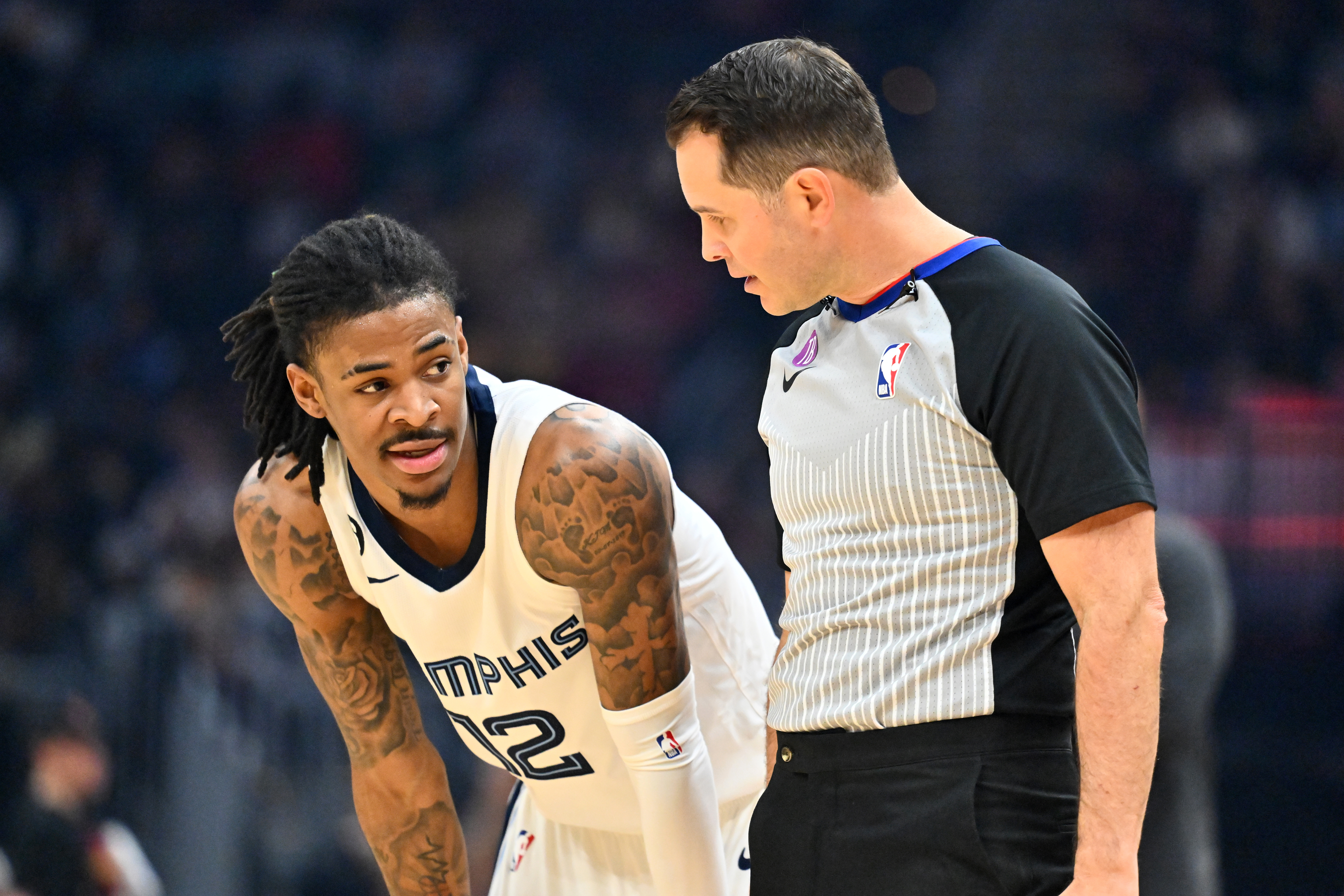 CLEVELAND, OHIO - FEBRUARY 02: Ja Morant #12 of the Memphis Grizzlies talks with referee Brian Forte #45 during the first quarter of the game against the Cleveland Cavaliers at Rocket Mortgage Fieldhouse on February 02, 2023 in Cleveland, Ohio. NOTE TO USER: User expressly acknowledges and agrees that, by downloading and or using this photograph, User is consenting to the terms and conditions of the Getty Images License Agreement. (Photo by Jason Miller/Getty Images)