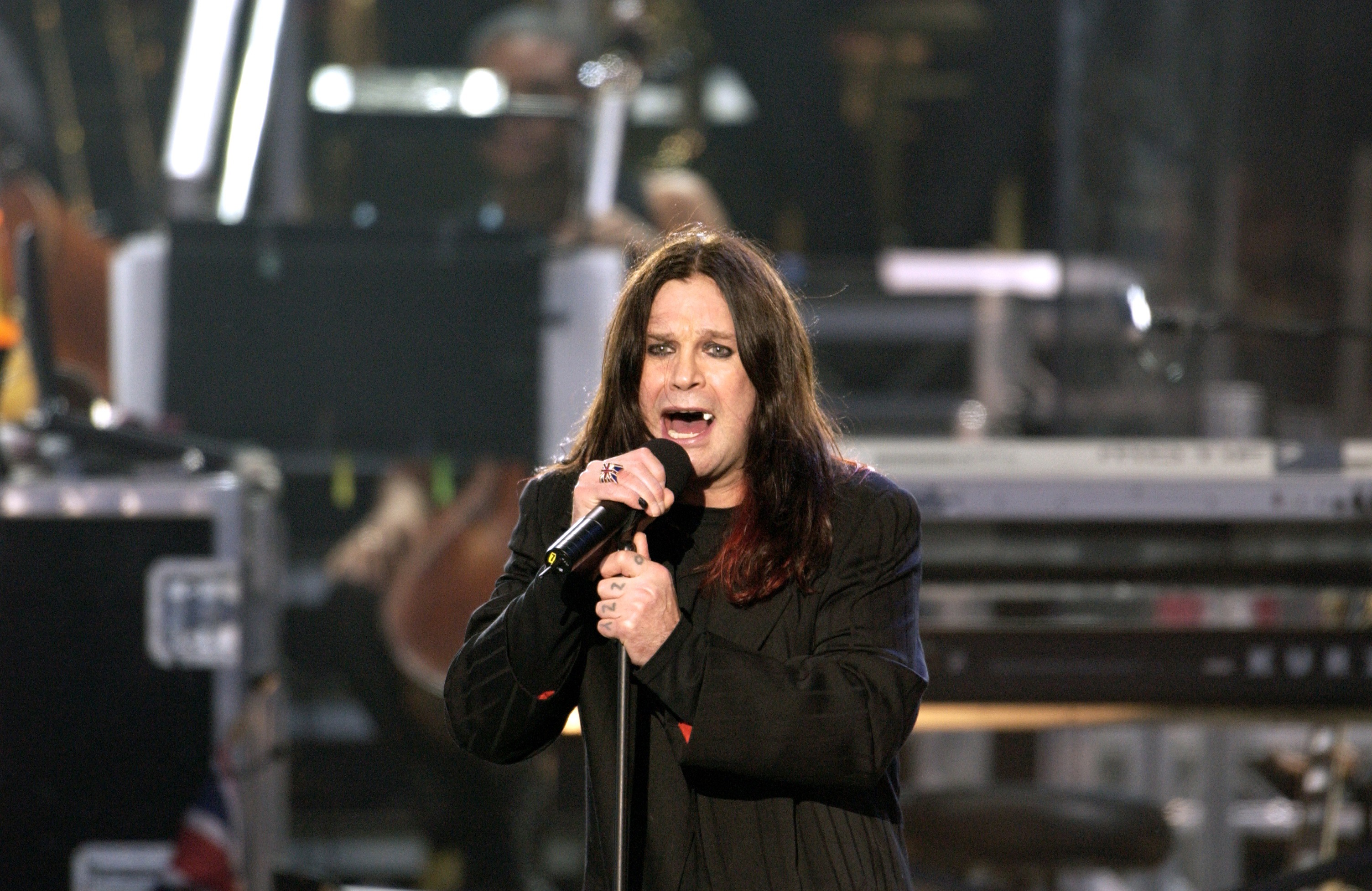 LONDON, UNITED KINGDOM - JUNE 03:  For The First Time In Her 50 Year Reign Queen Elizabeth II Held A Pop Concert - "party At The Palace"  - In Her Garden At Buckingham Palace.  Rock Singer Ozzy Osbourne Made The Journey From His Home In America To Entertain 12,000  Guests In The Garden, A Crowd Of Almost A Million In The Mall In Front Of The Palace Who Watched The Concert On Giant Screens And Millions Watching The Broadcast Around The World.  (Photo by Tim Graham Photo Library via Getty Images)