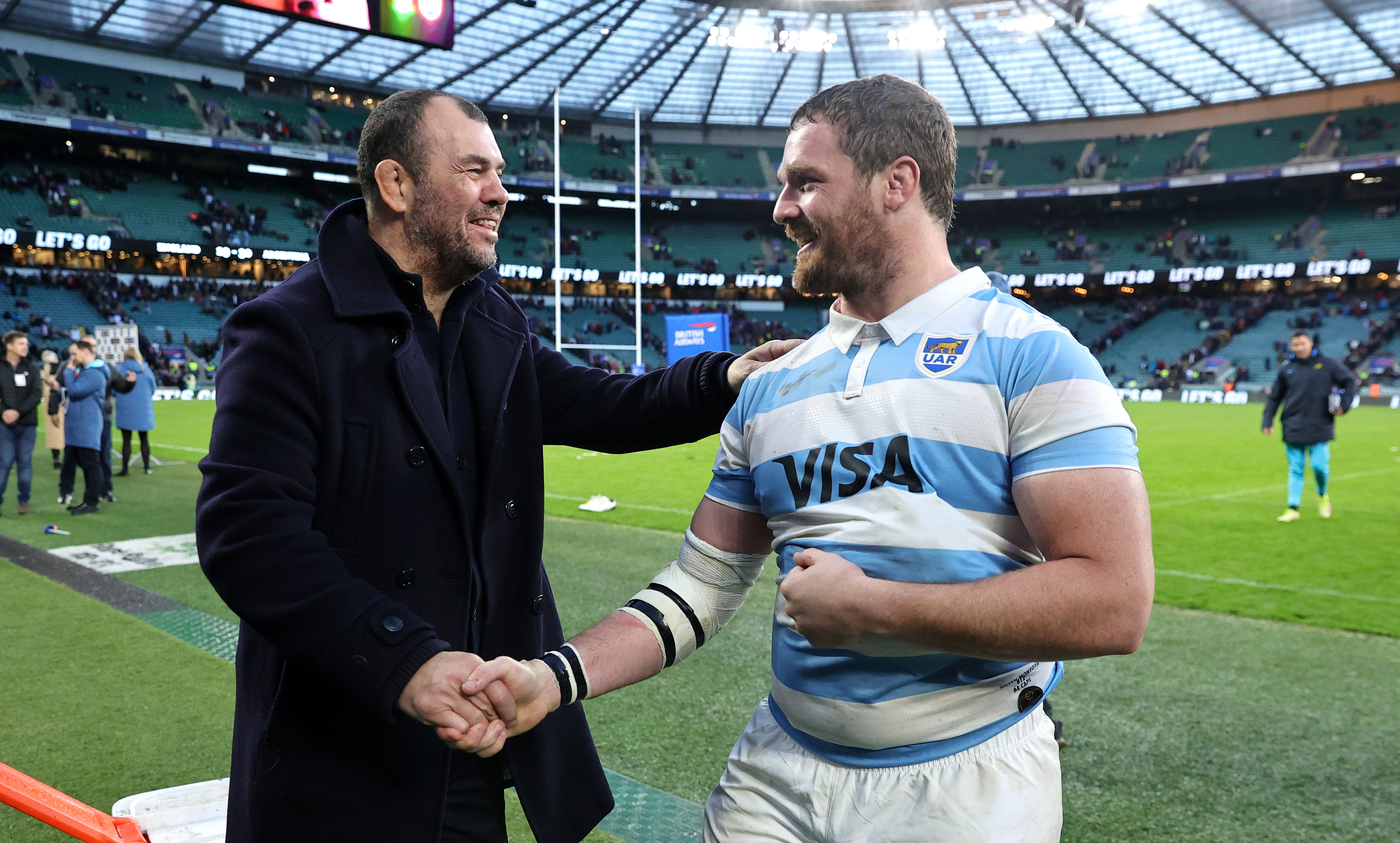 Michael Cheika, the Argentina coach, celebrates with team captain Julian Montoya.