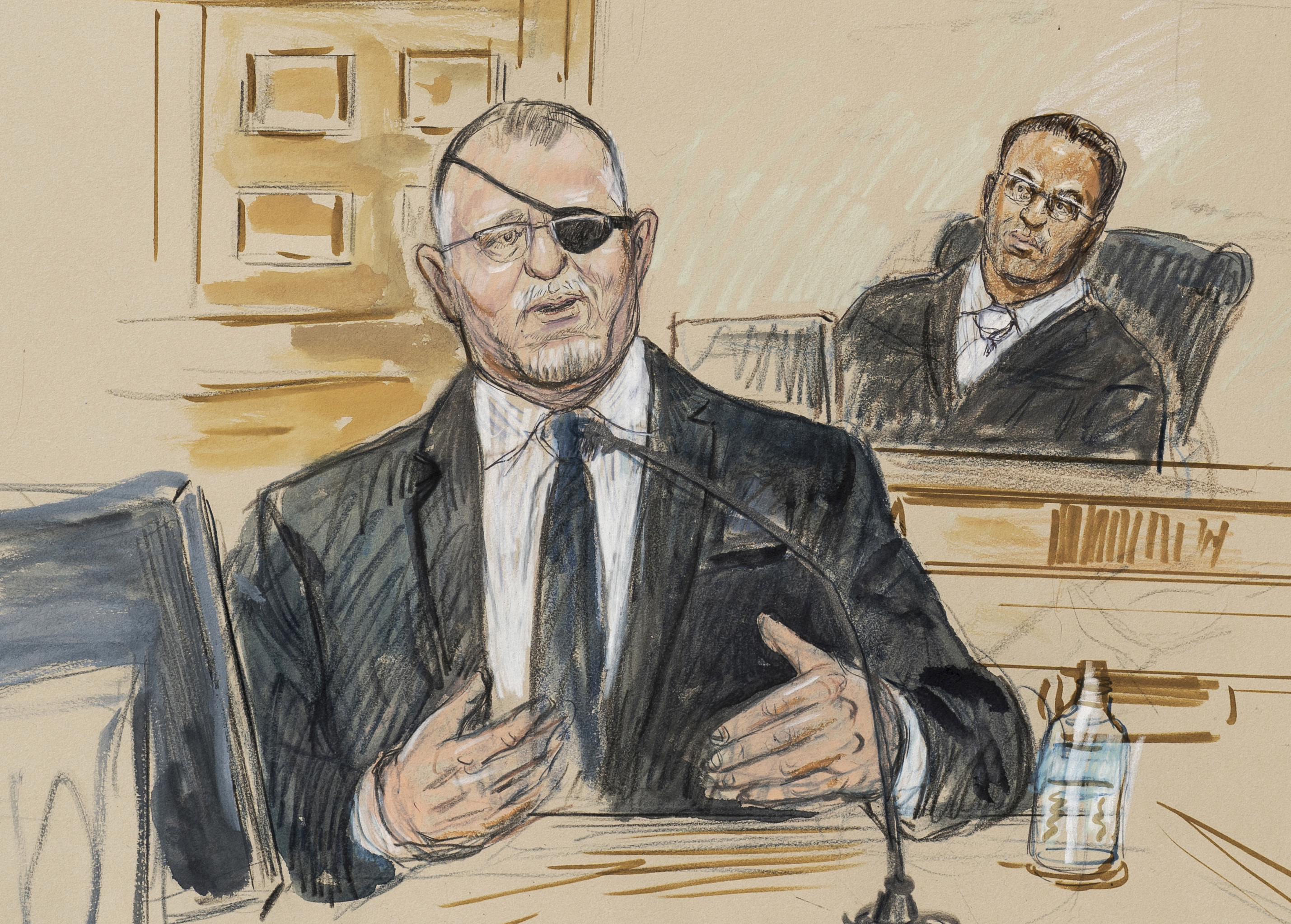 This artist sketch depicts the trial of Oath Keepers leader Stewart Rhodes, left, as he testifies before U.S. District Judge Amit Mehta on charges of seditious conspiracy in the Jan. 6, 2021, attack on the U.S. Capitol, in Washington, Nov. 7, 2022.