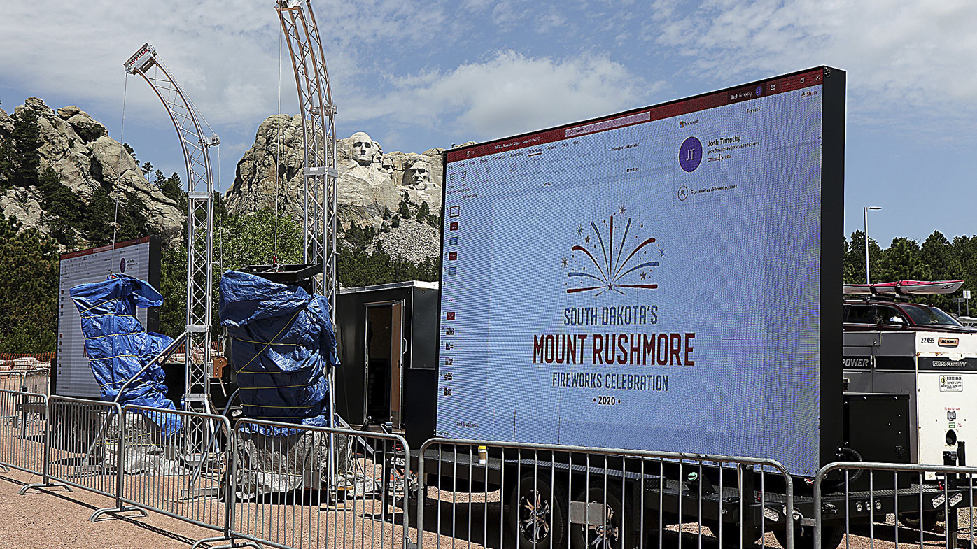 Mount Rushmore fireworks event staff test the video displays for Level 2 ticket holders across Highway 244 from the parking ramps at Mount Rushmore National Memorial, S.D., Thursday, July 2, 2020