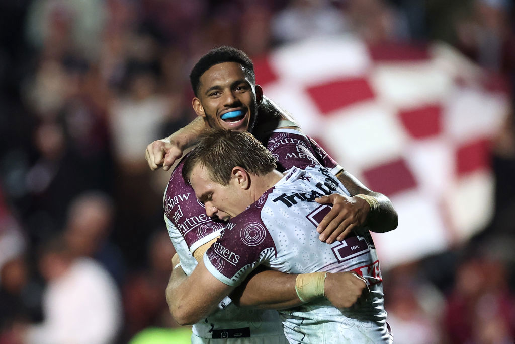 Jason Saab celebrates with Jake Trbojevic on the field. 