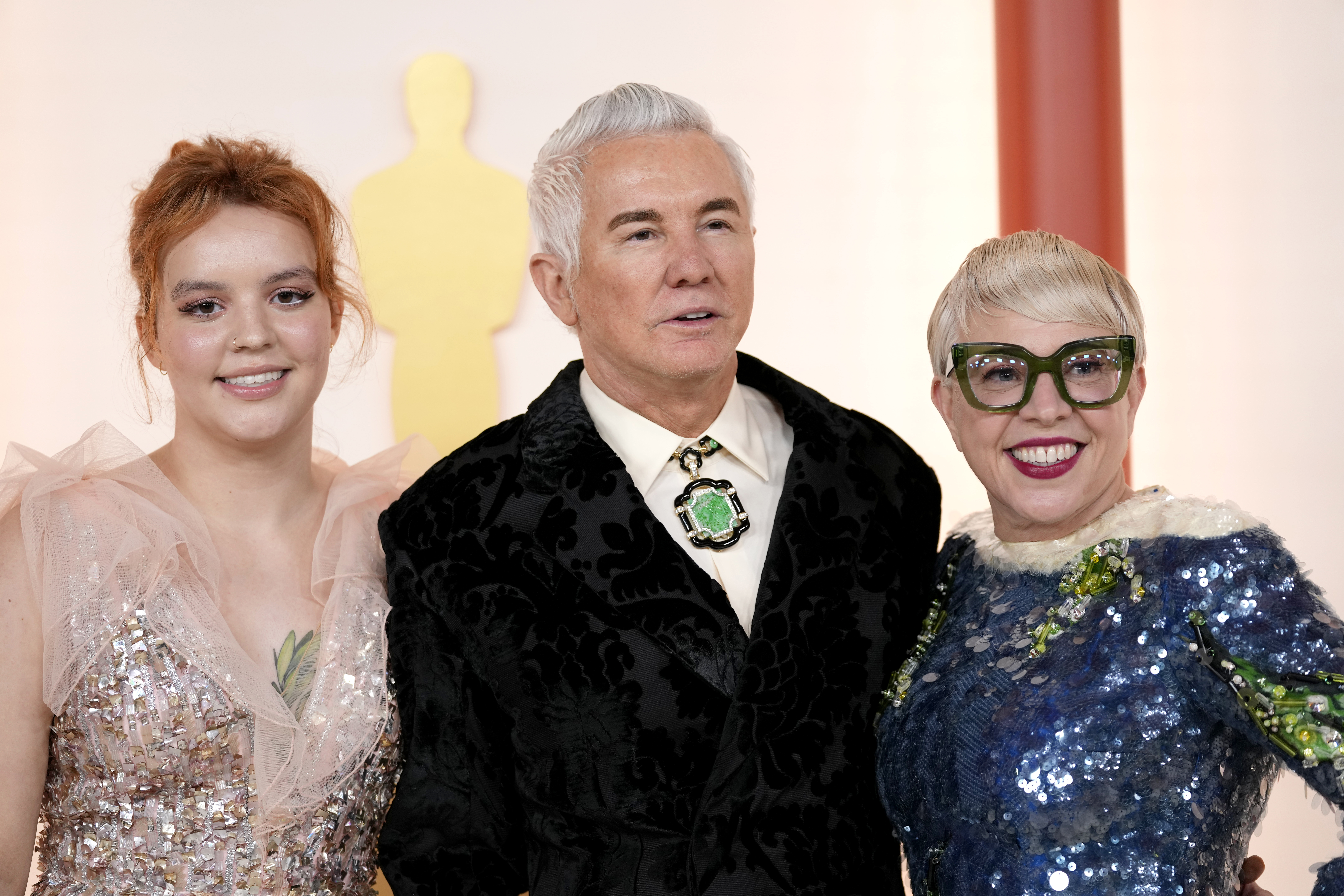 Lilly Luhrmann, Baz Luhrmann and Catherine Martin arrive at the Oscars on Sunday, March 12, 2023, at the Dolby Theatre in Los Angeles. (AP Photo/Ashley Landis)