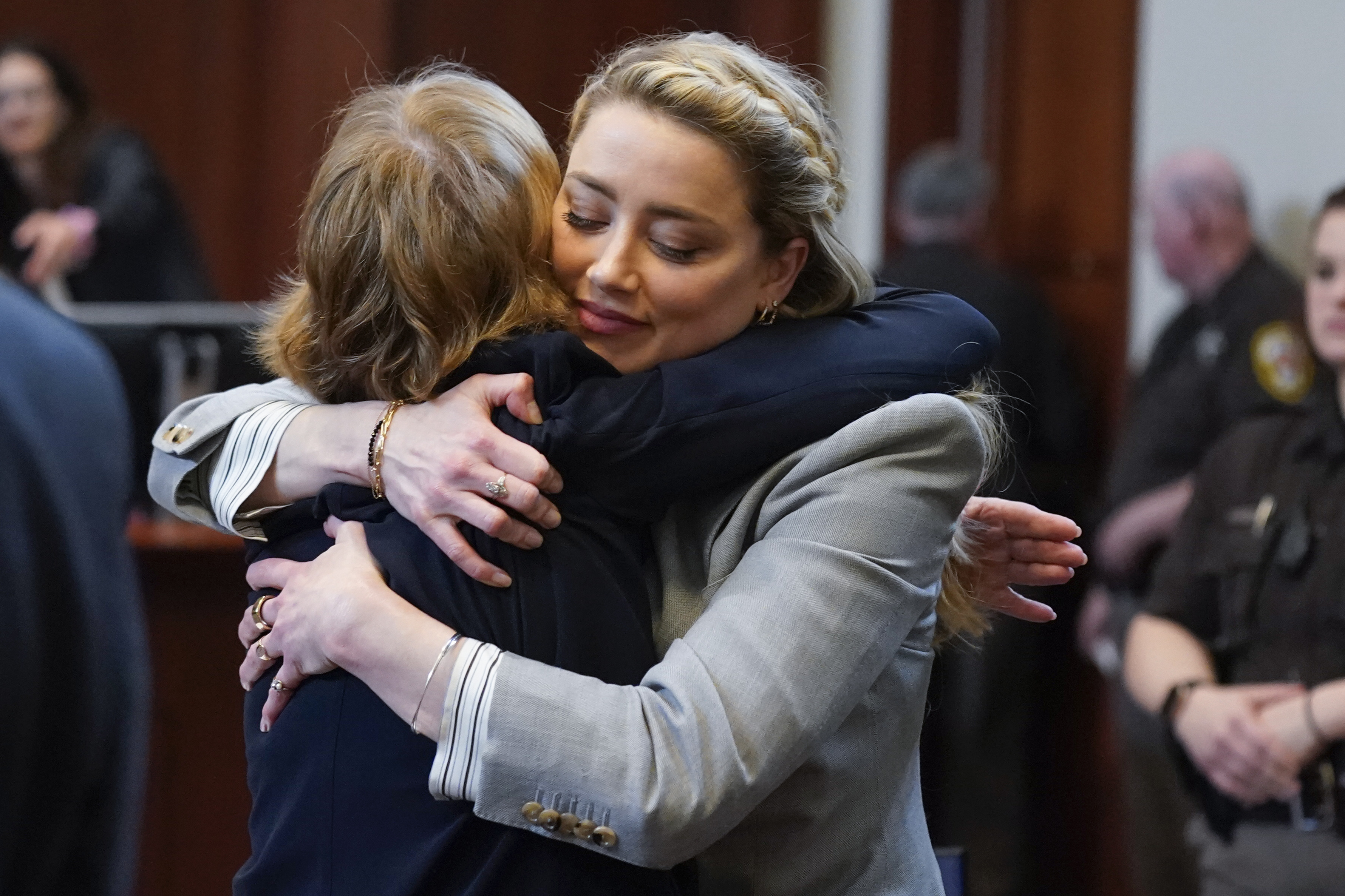 Amber Heard hugs her attorney Elaine Bredehoft after closing arguments