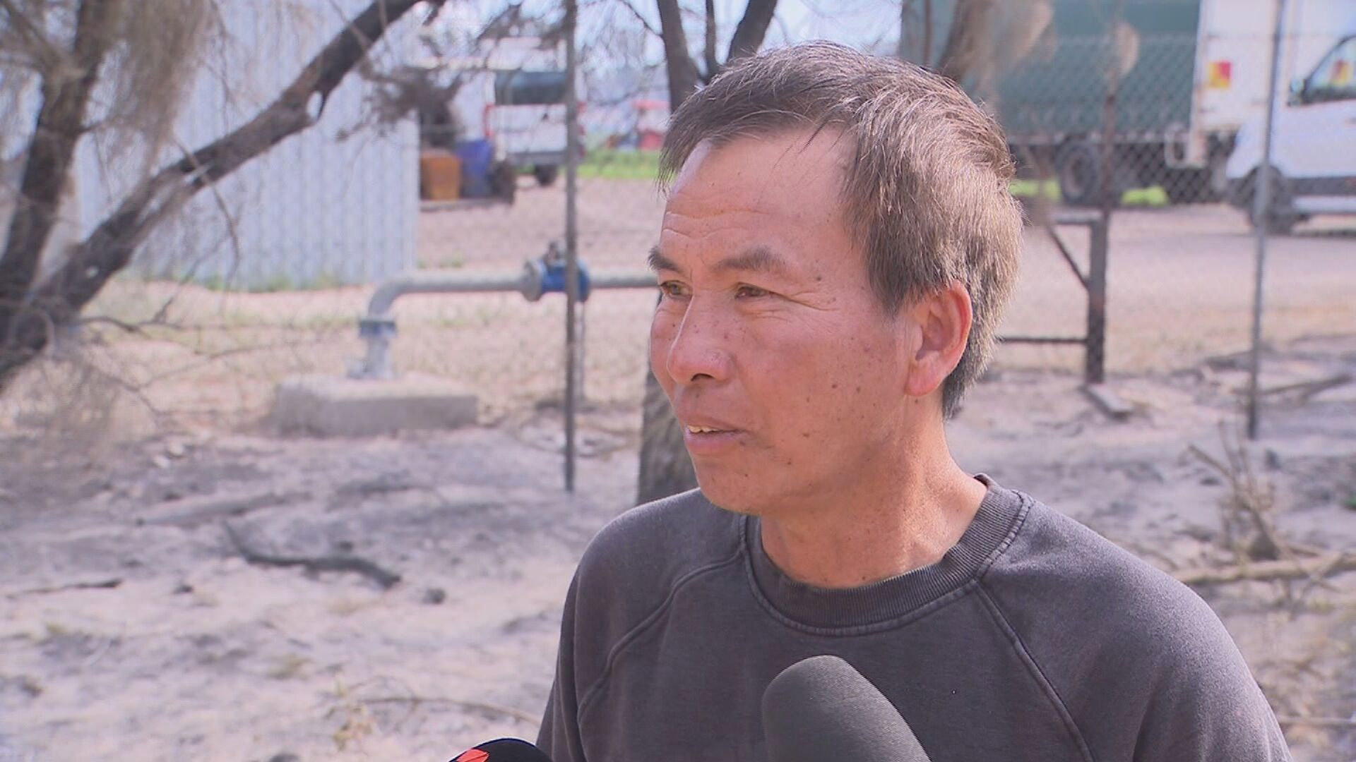 Dhanh Dinh made a dash from his Mariginiup farm on Ranch Road last night. Bushfires in Perth's northern suburbs.