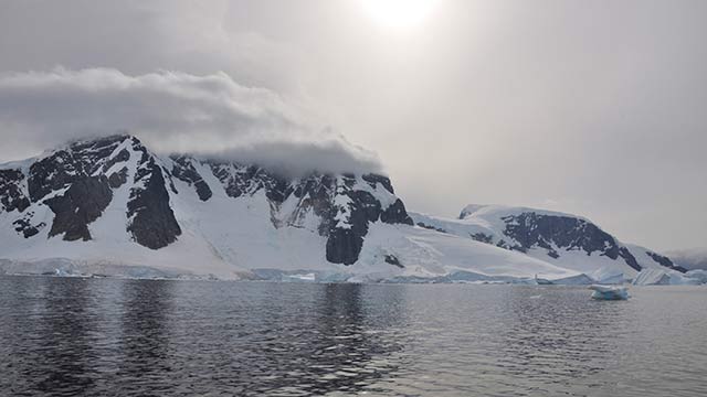 Wind blowing over the top of a peak in Antarctica in February, 2013. (Getty)