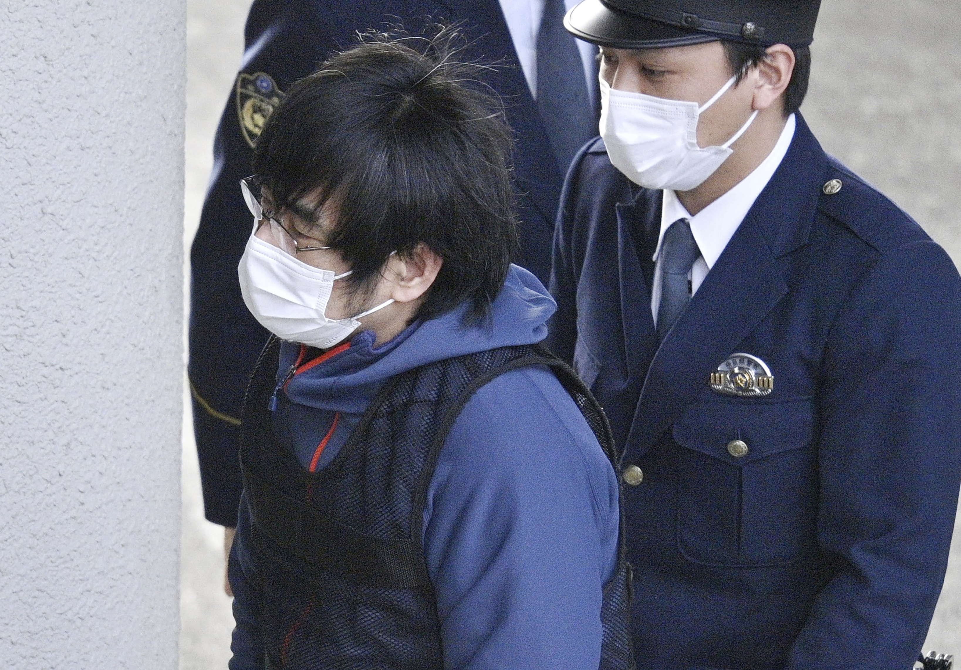 Tetsuya Yamagami, the alleged assassin of Japan's former Prime Minister Shinzo Abe, enters a police station in Nara, western Japan, on Jan. 10, 2023.  