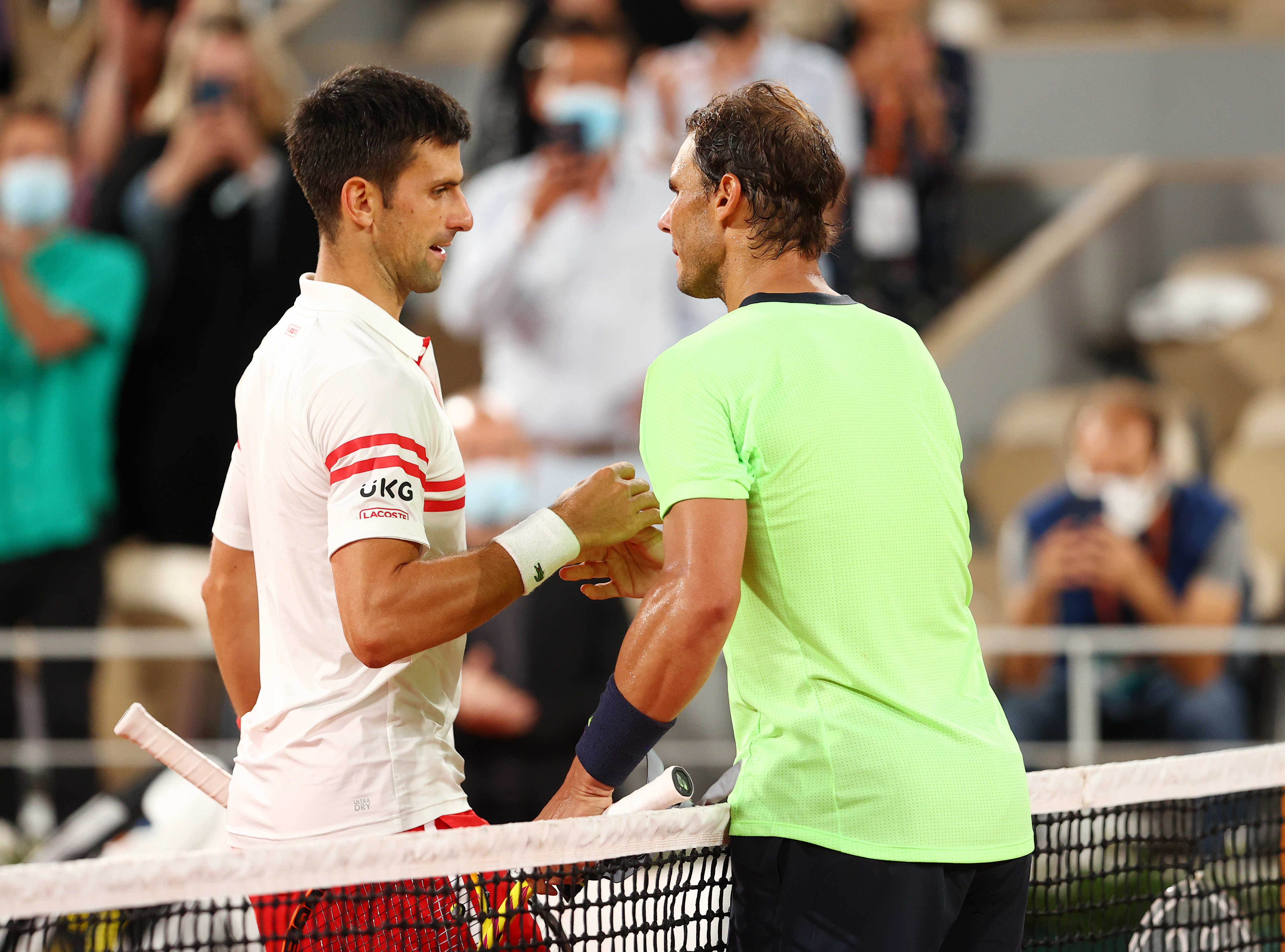 Novak Djokovic of Serbia shakes hands with Rafael Nadal of Spain.