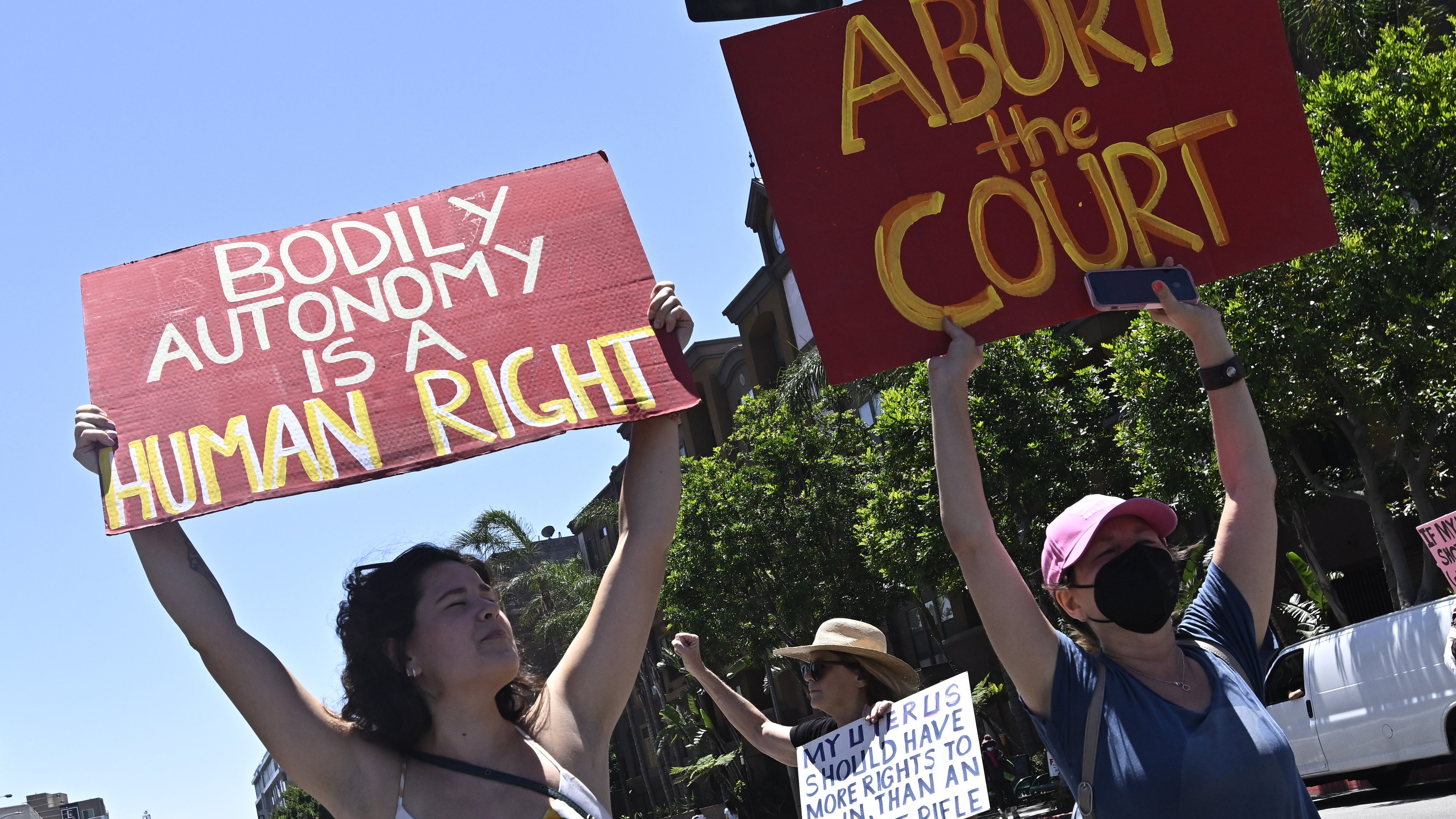 Activists march through downtown Los Angeles, Saturday, June 25, 2022, as they protest the Supreme Court's ruling on abortion. 
