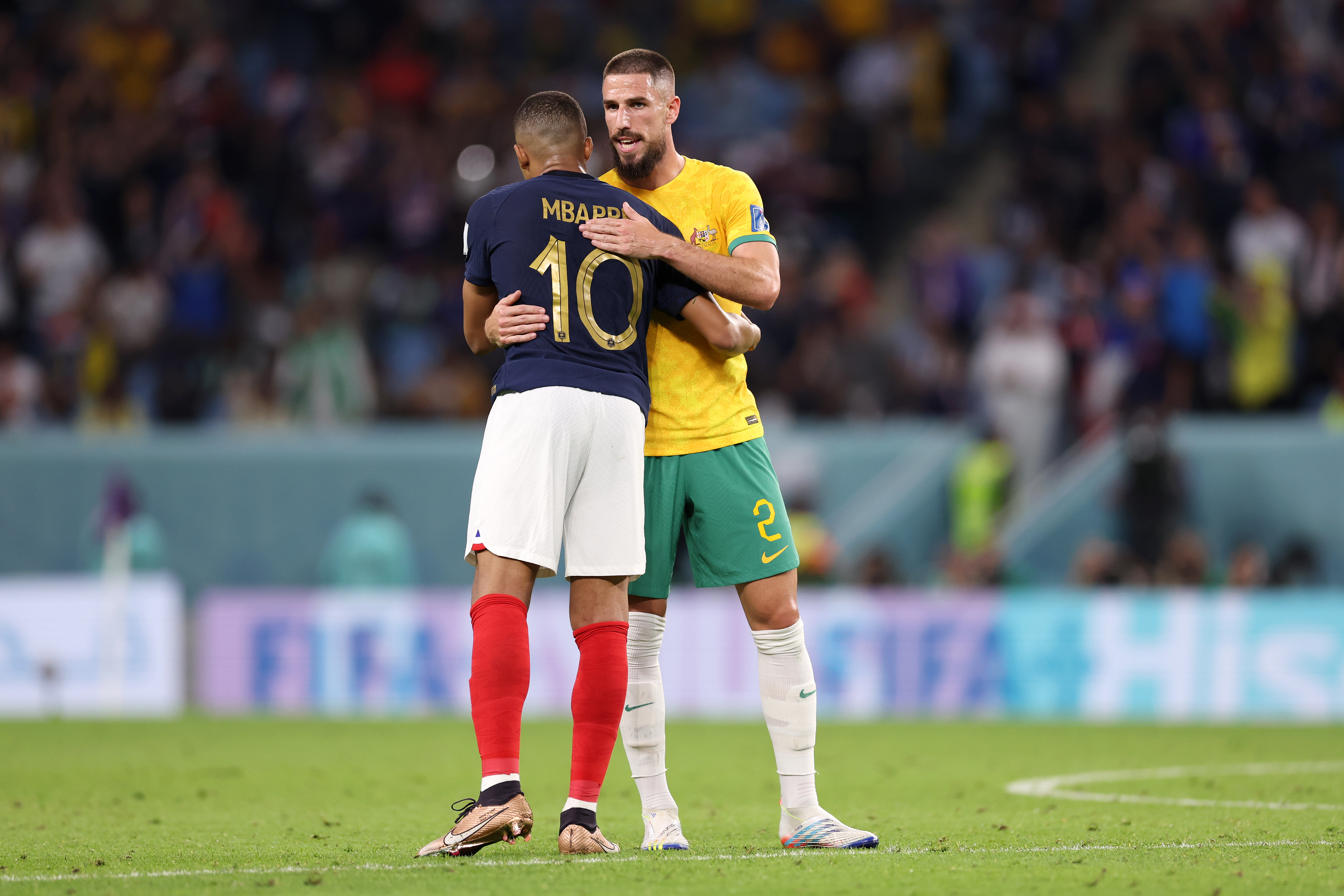 Kylian Mbappe of France embraces Milos Degenek of Australia after the Group D match. (Photo by Maddie Meyer - FIFA/FIFA via Getty Images)