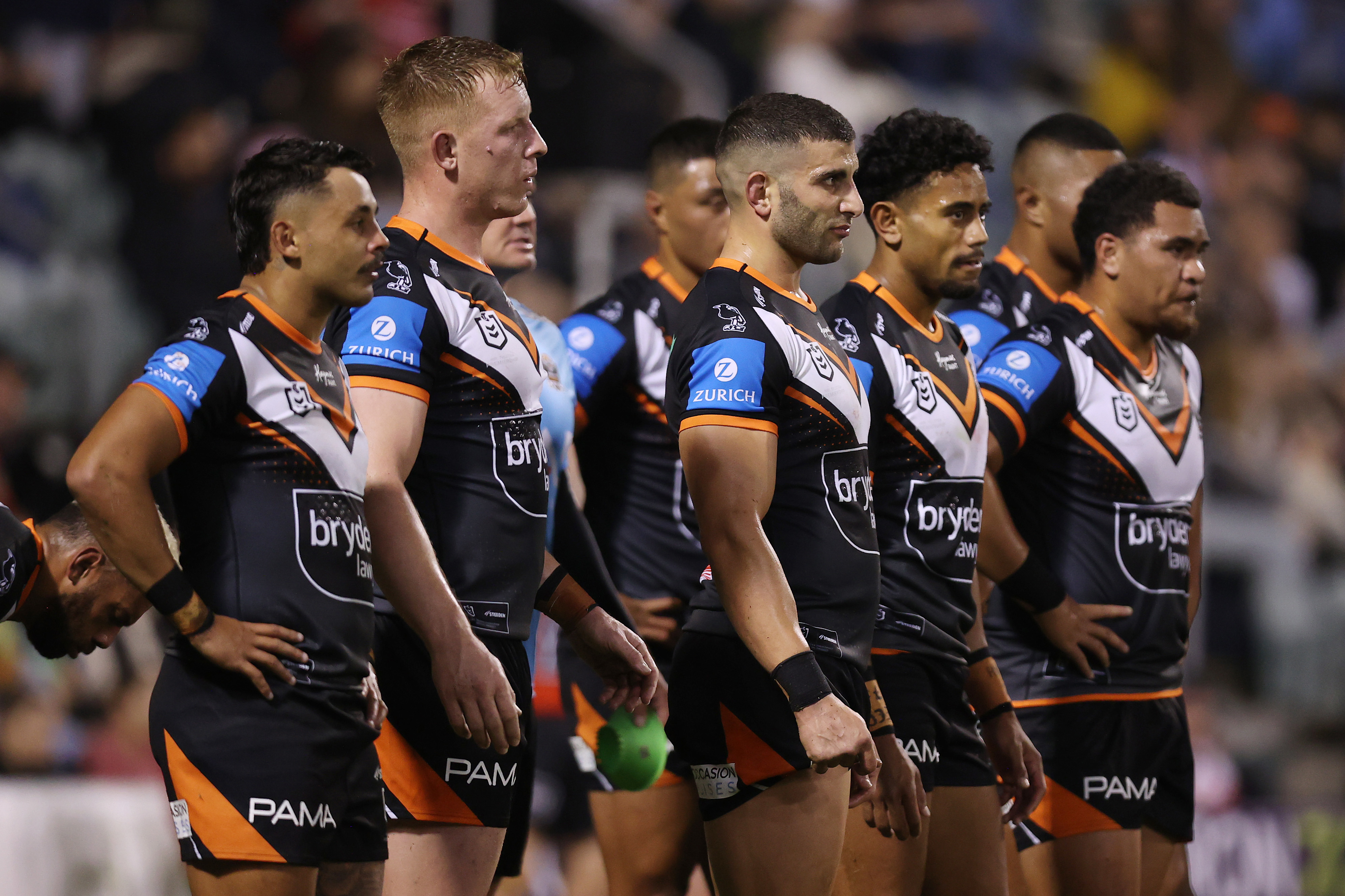 Wests Tigers players look on after a Dragons try during the round 14 NRL match between St George Illawarra Dragons and Wests Tigers at WIN Stadium on June 07, 2024, in Wollongong, Australia. (Photo by Jason McCawley/Getty Images)