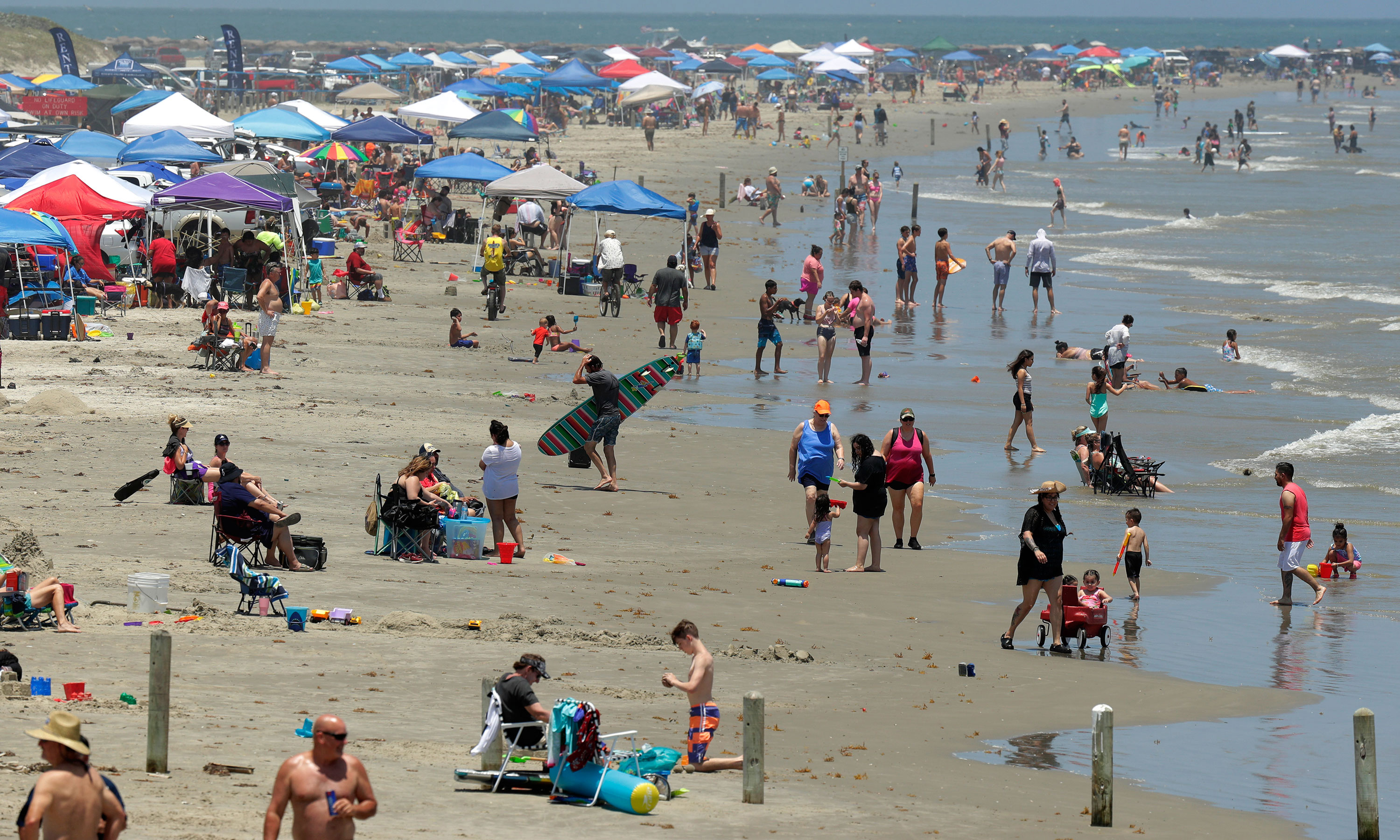 People gather on the beach for the Memorial Day weekend in Port Aransas, Texas.