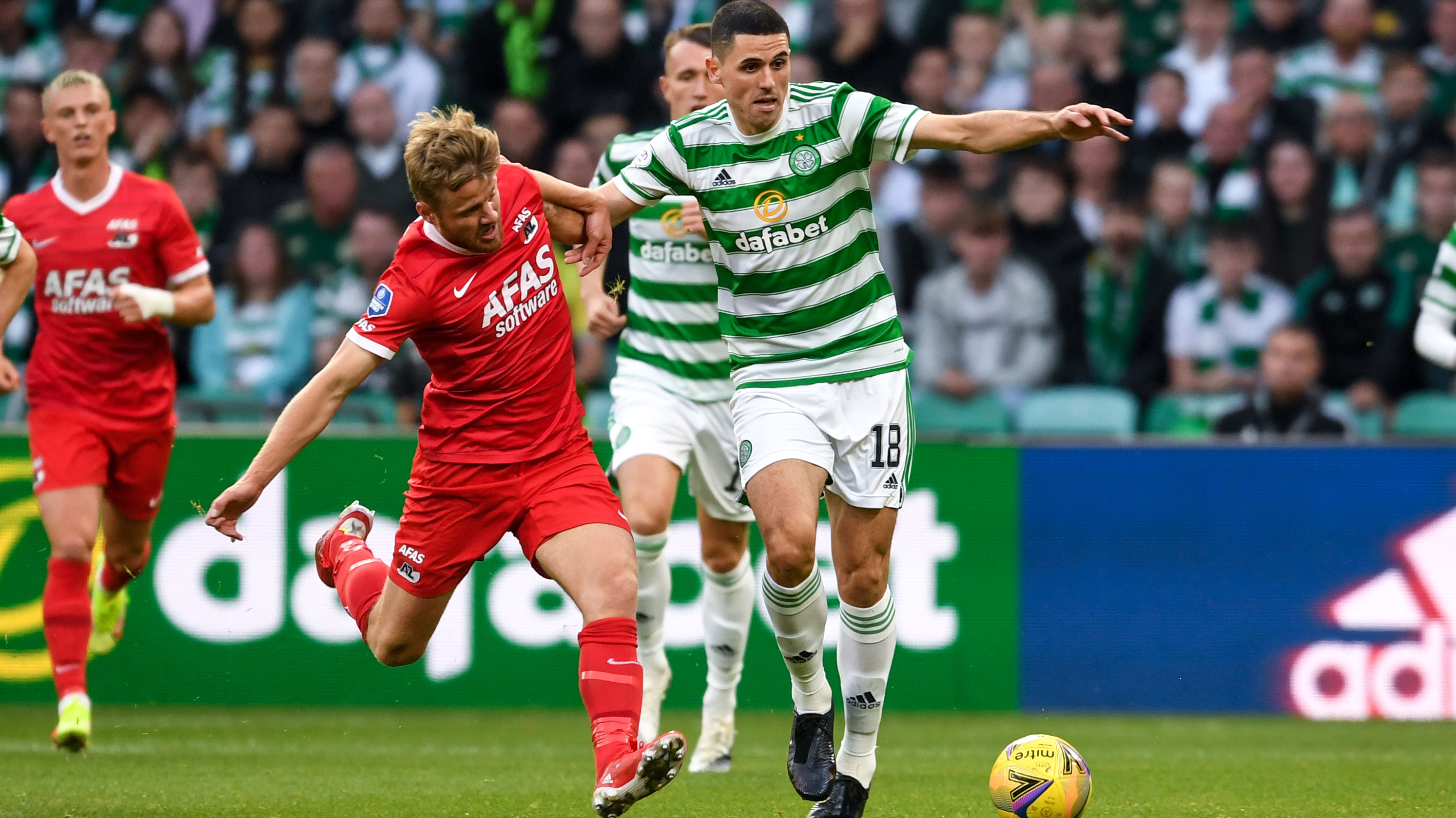 Tom Rogic holds off Dani de Wit during Celtic's firlt leg victory over AZ Alkmaar in their UEFA Europa League qualifier.