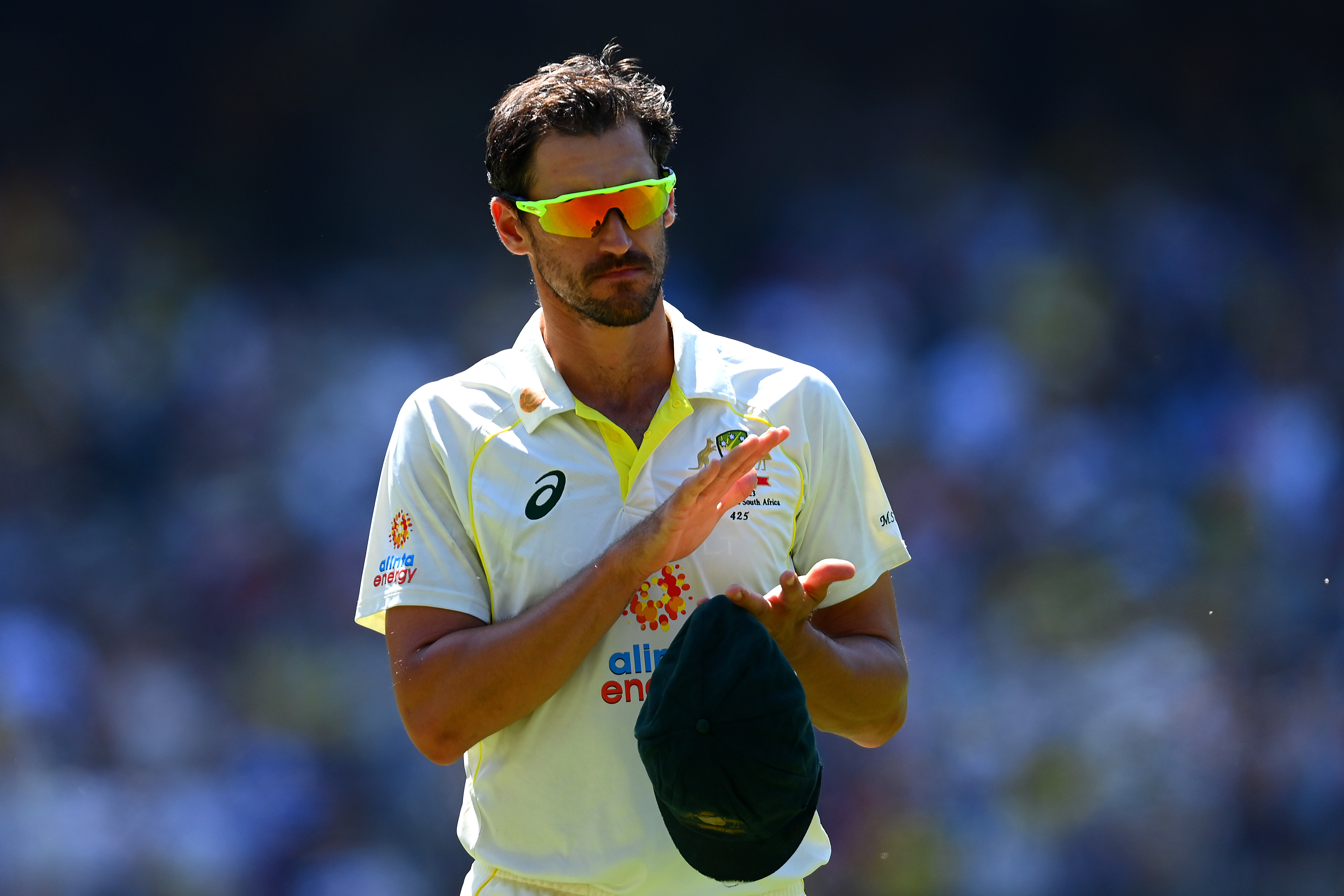 MELBOURNE, AUSTRALIA - DECEMBER 26: Mitchell Starc of Australia claps a tribute to Shane Warne during day one of the Second Test match in the series between Australia and South Africa at Melbourne Cricket Ground on December 26, 2022 in Melbourne, Australia. (Photo by Quinn Rooney/Getty Images)