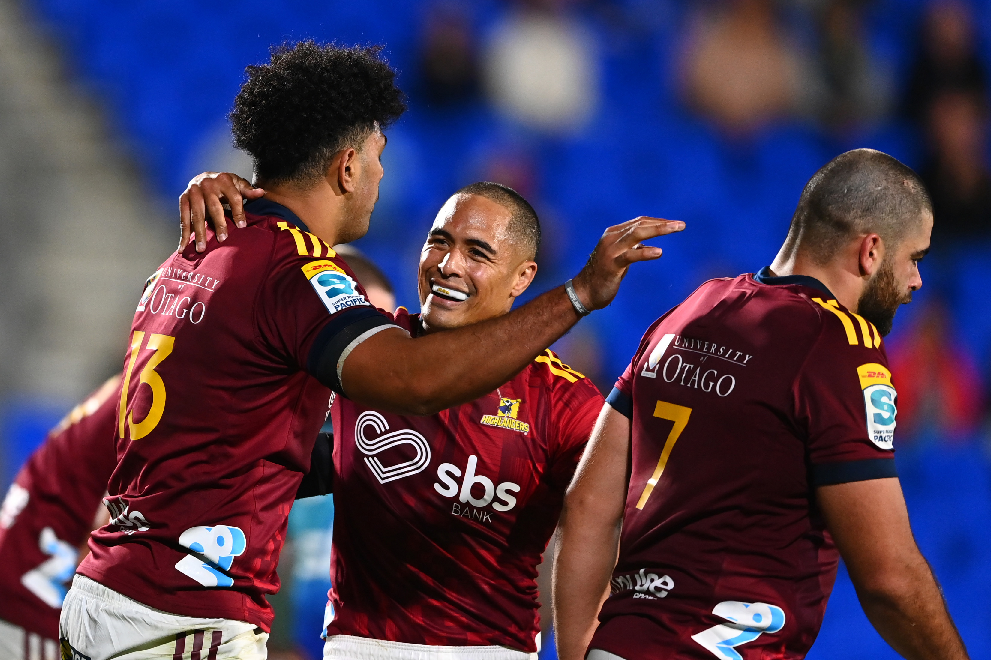 Fetuli Paea of the Highlanders celebrates after scoring a try with Aaron Smith.