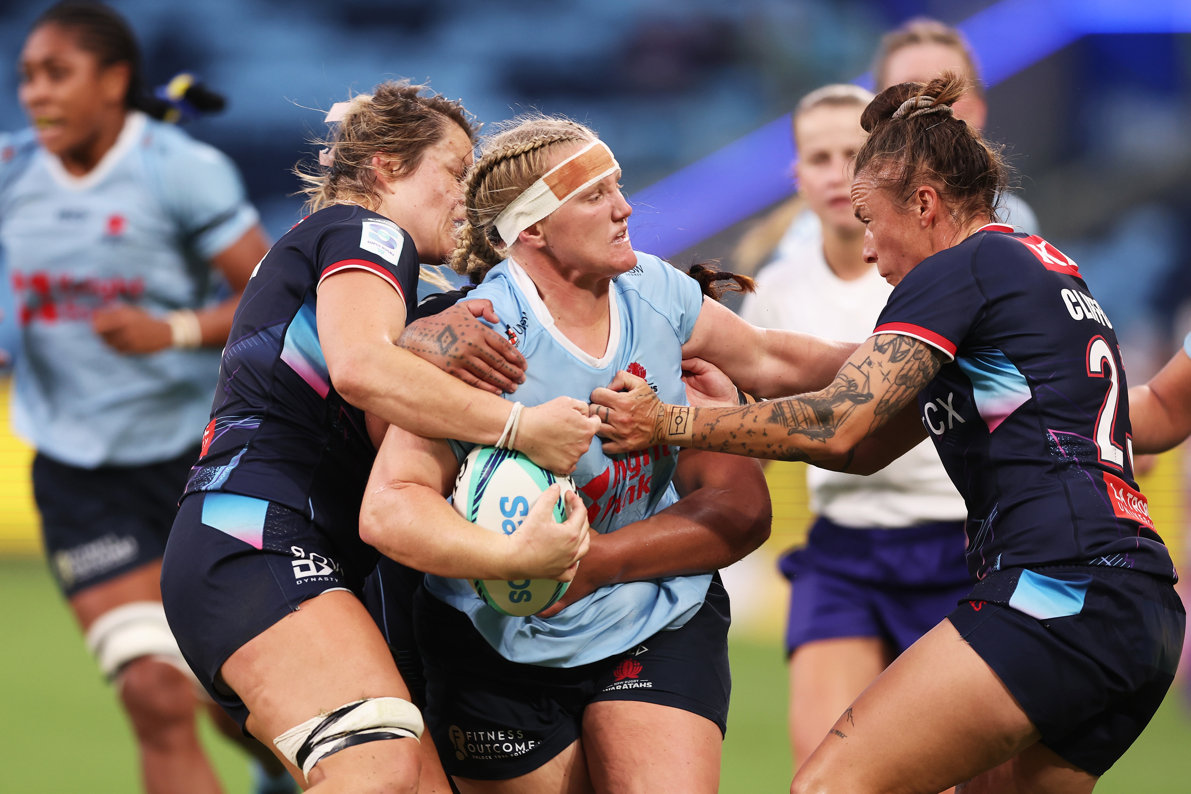 Emily Robinson is tackled during the round three Super Rugby Women's match between the NSW Waratahs and the Melbourne Rebels.