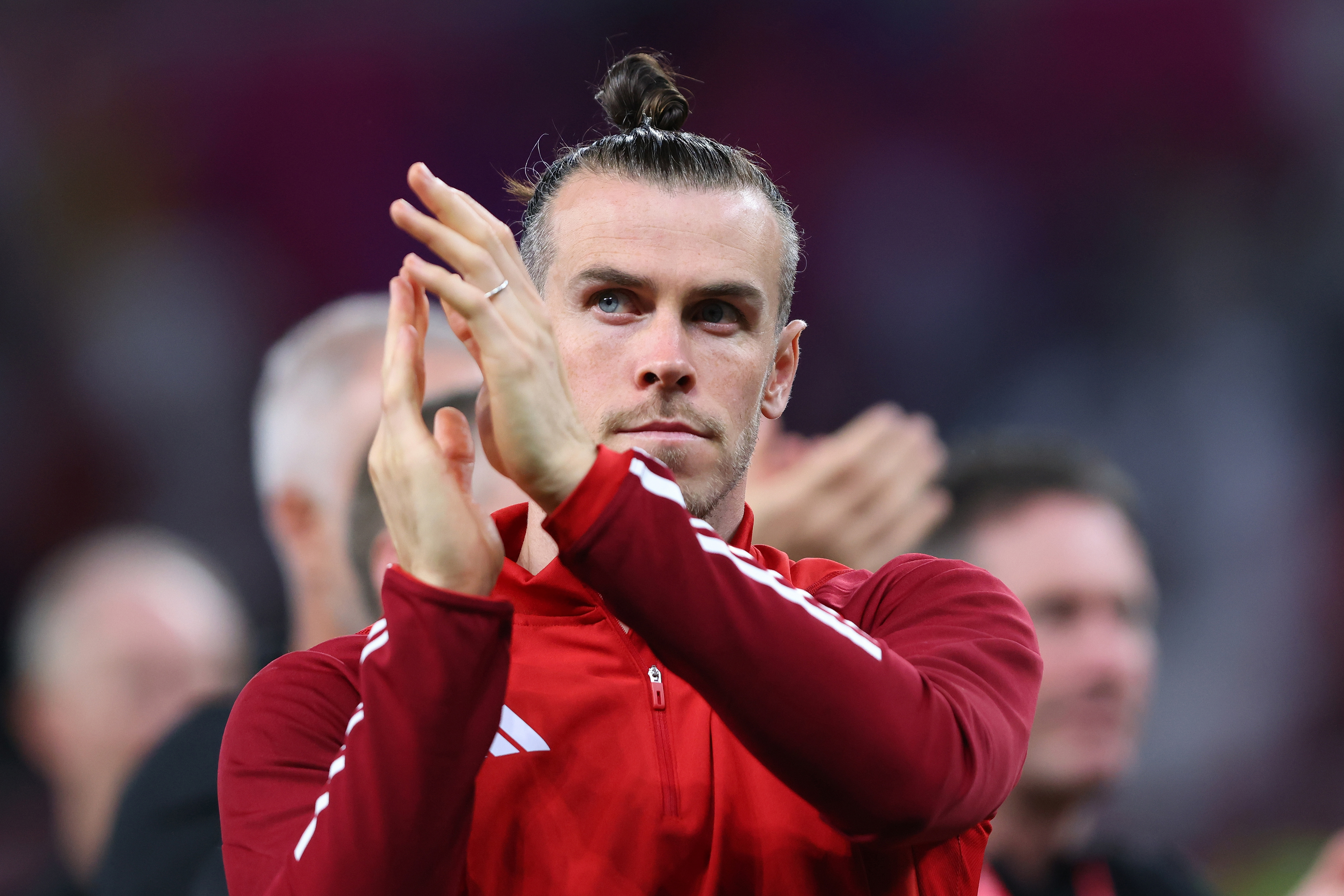 DOHA, QATAR - NOVEMBER 29:  Gareth Bale of Wales looks dejected as he applauds the fans during the FIFA World Cup Qatar 2022 Group B match between Wales and England at Ahmad Bin Ali Stadium on November 29, 2022 in Doha, Qatar. (Photo by Marc Atkins/Getty Images)