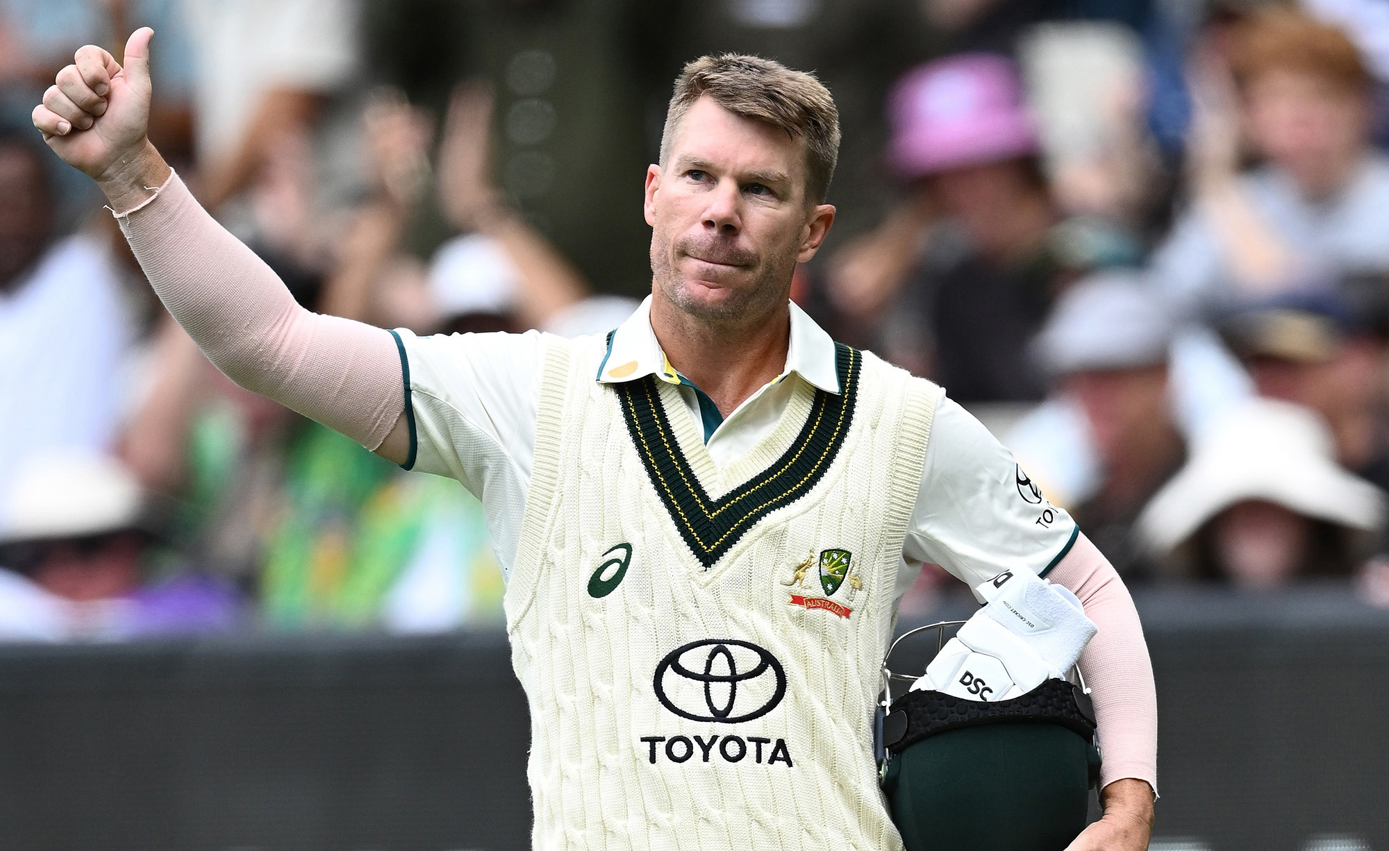 David Warner waves farewell to the MCG.