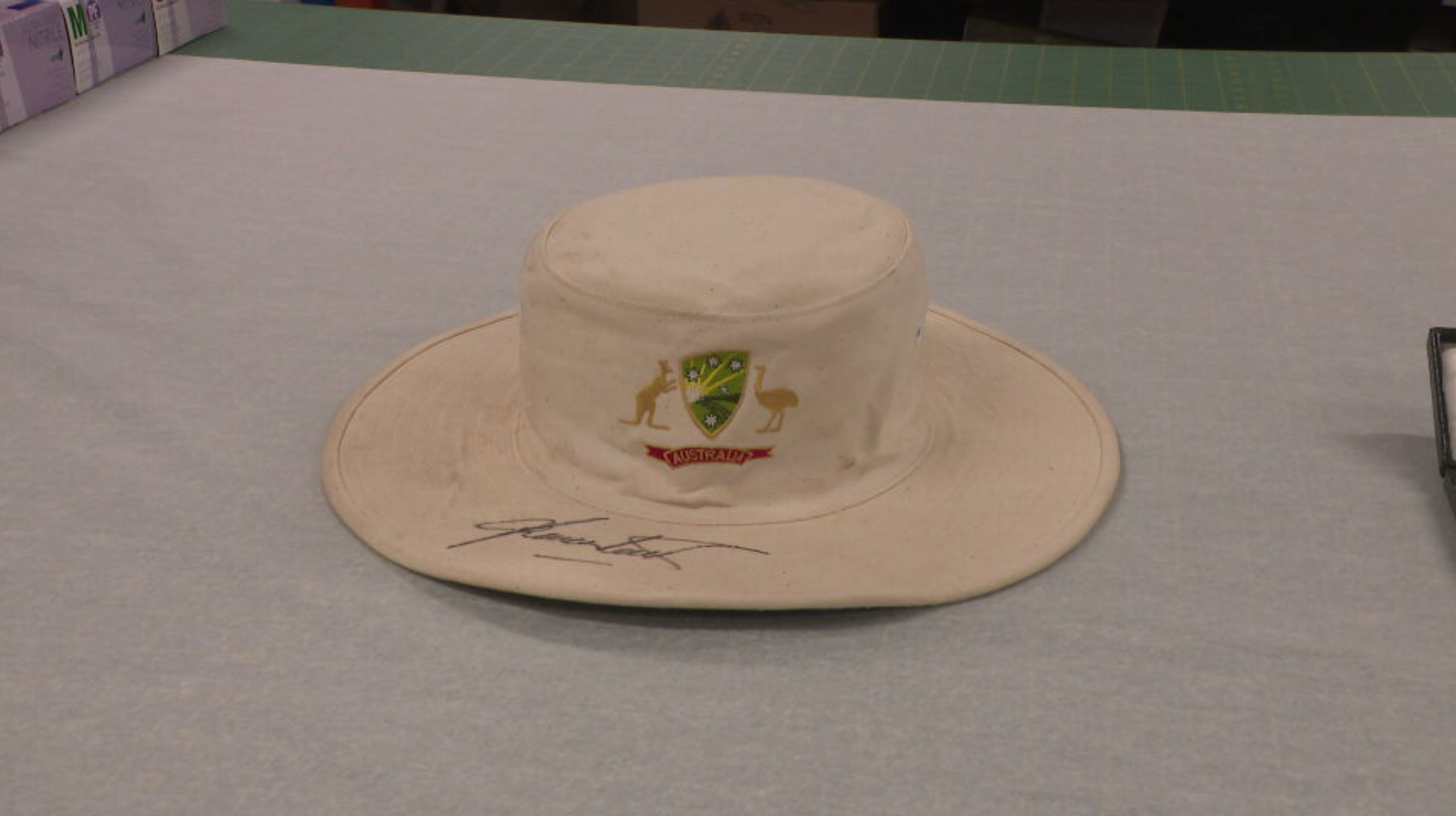 Warnie's white floppy hat is among the memorabilia on display.