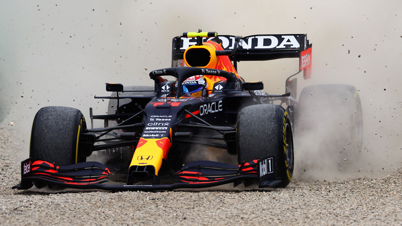 Sergio Perez runs through the gravel after an incident with Lando Norris at the Austrian Grand Prix.