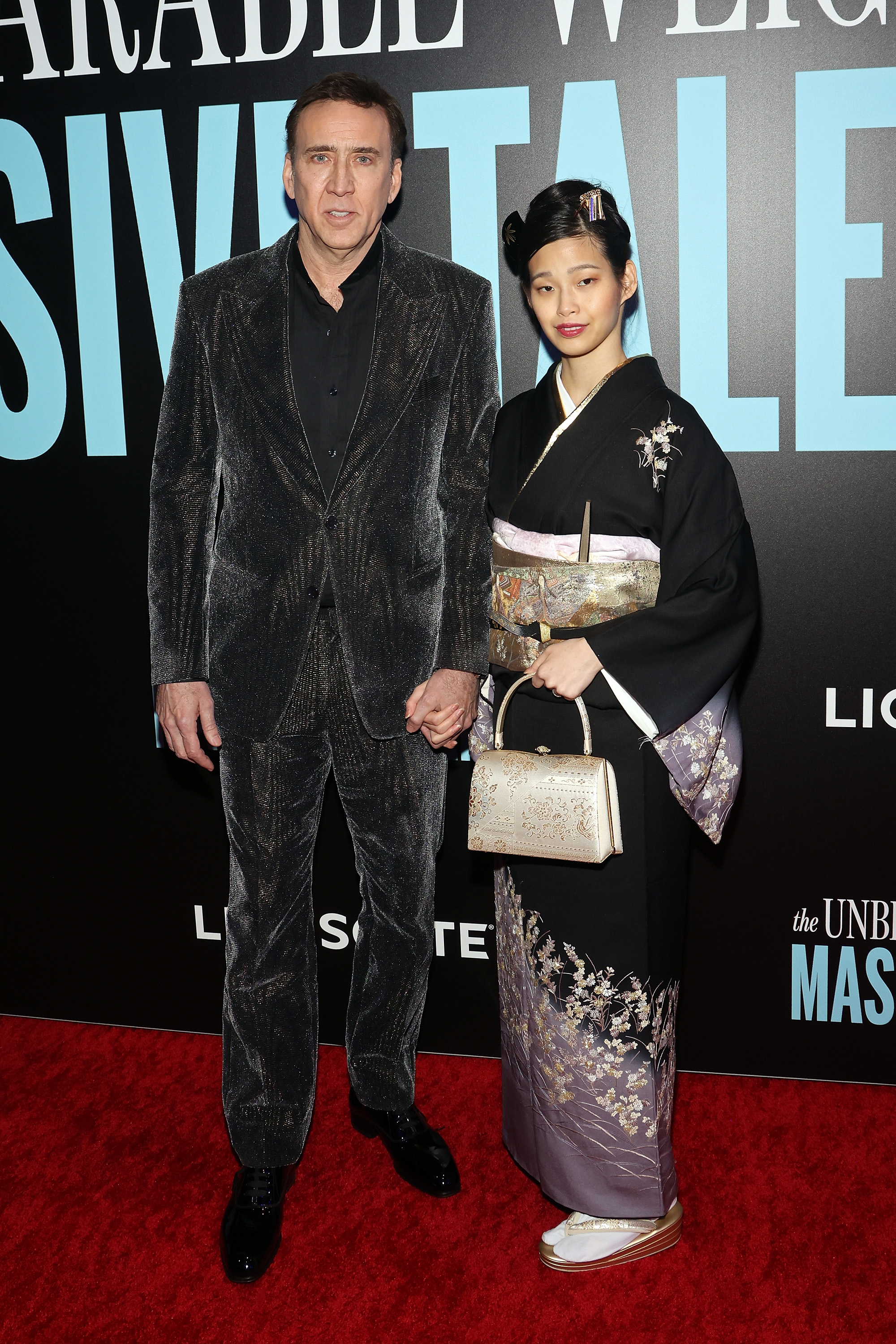 Nicolas Cage and Riko Shibata attend the New York premiere of The Unbearable Weight of Massive Talent on April 10 in New York City. 