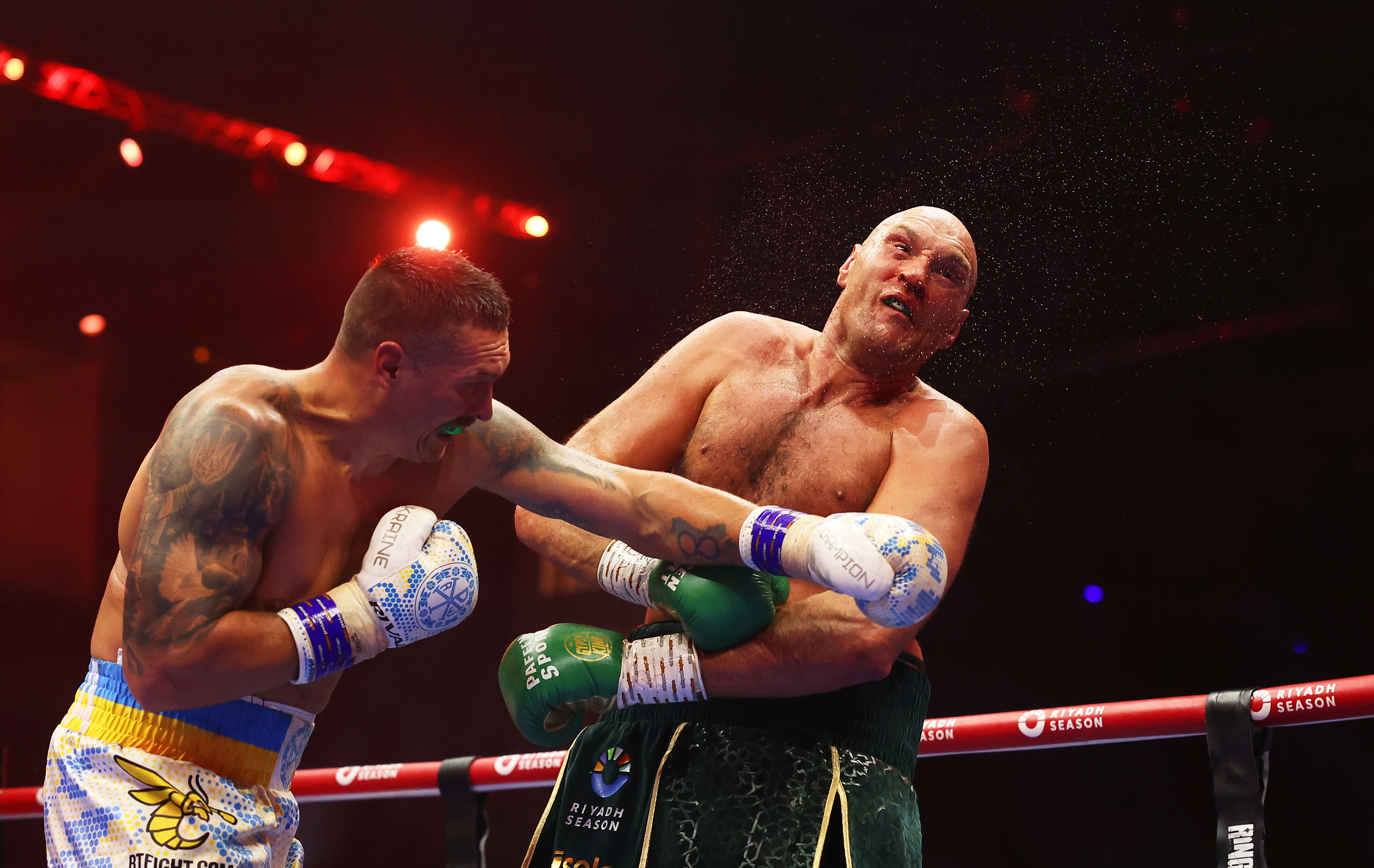 Oleksandr Usyk punches Tyson Fury during the IBF, WBA, WBC, WBO and Undisputed Heavyweight titles' fight between Tyson Fury and Oleksandr Usyk at Kingdom Arena on May 18, 2024 in Riyadh, Saudi Arabia. (Photo by Richard Pelham/Getty Images)