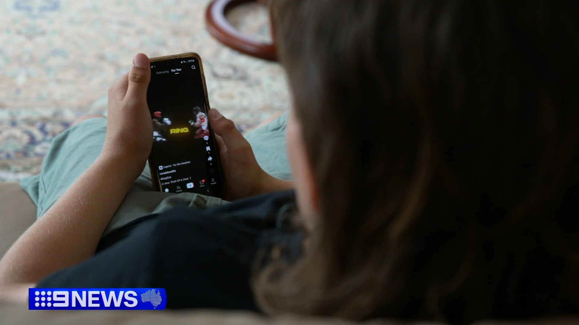 Children using social media on a smart phone.