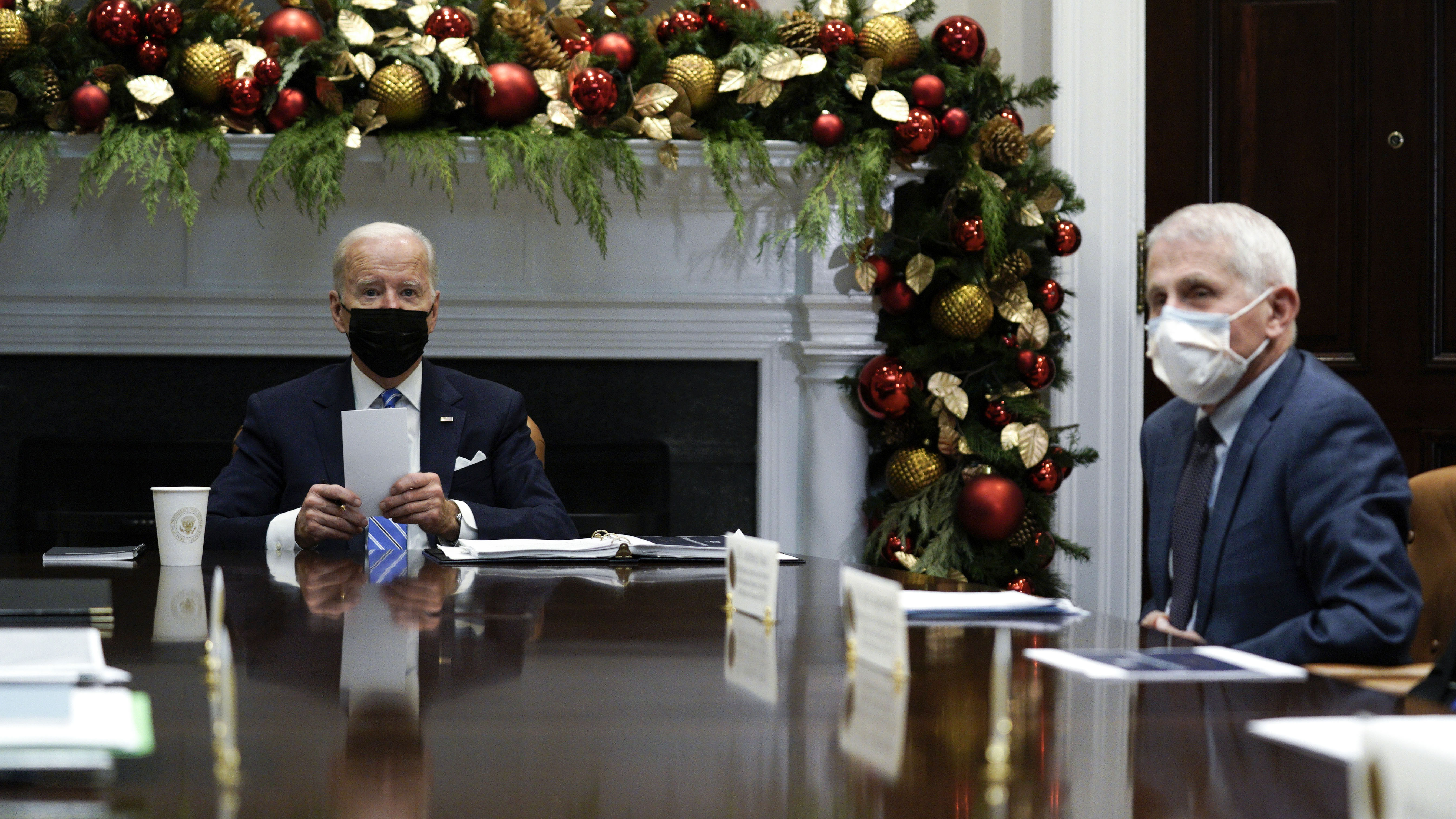 US President Joe Biden speaks while meeting with members of the White House Covid-19 Response Team on the Omicron variant including Anthony Fauci.