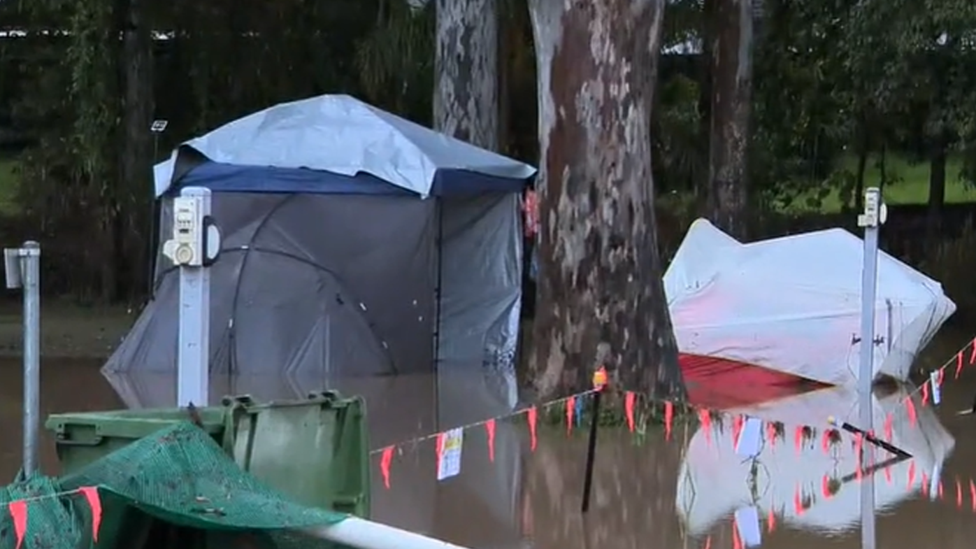 Tents were swallowed by muddy brown water on the Gold Coast site.