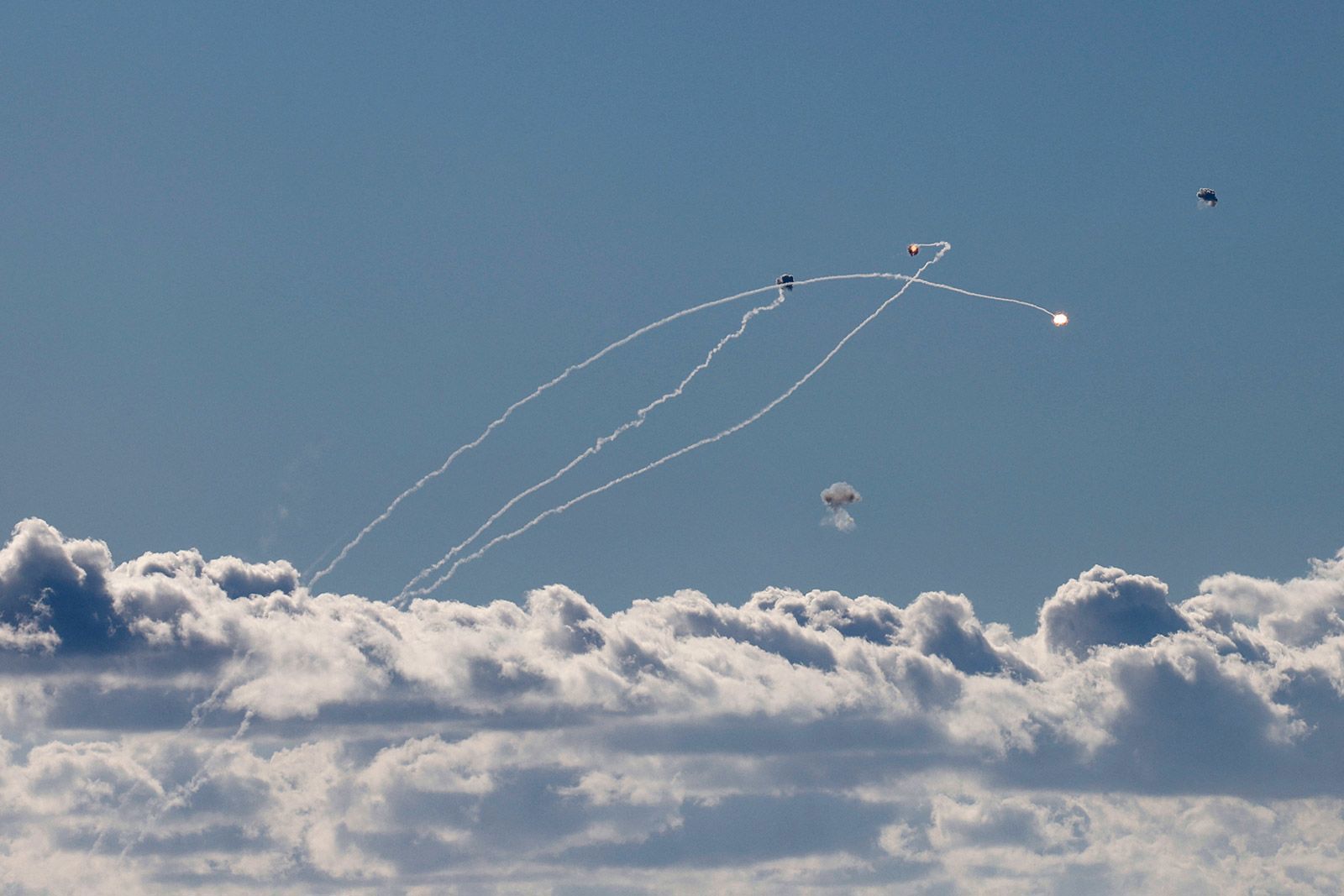 Rockets fired from southern Lebanon are intercepted by Israel's Iron Dome air defence system over the Upper Galilee region in northern Israel on September 18.