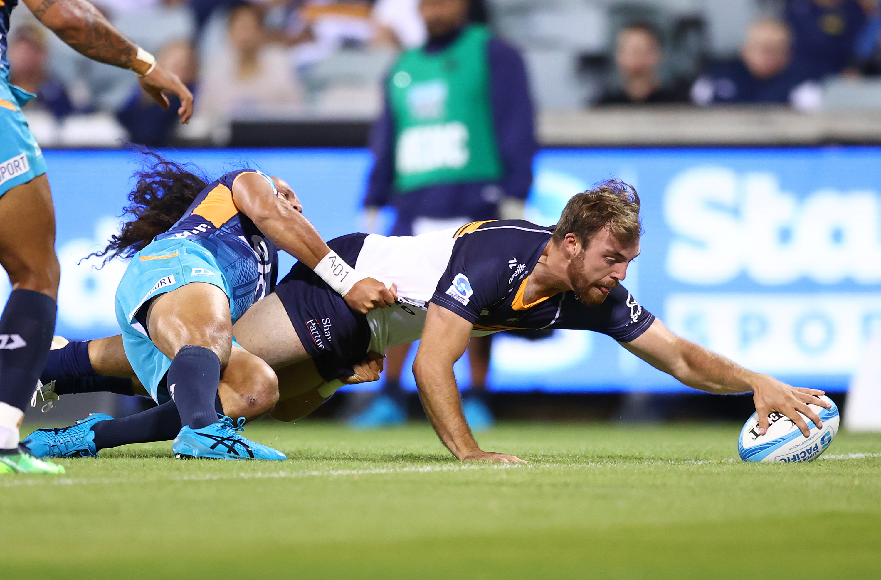 Hudson Creighton of the Brumbies scores a tryduring the round five Super Rugby Pacific match between ACT Brumbies and Moana Pasifika.