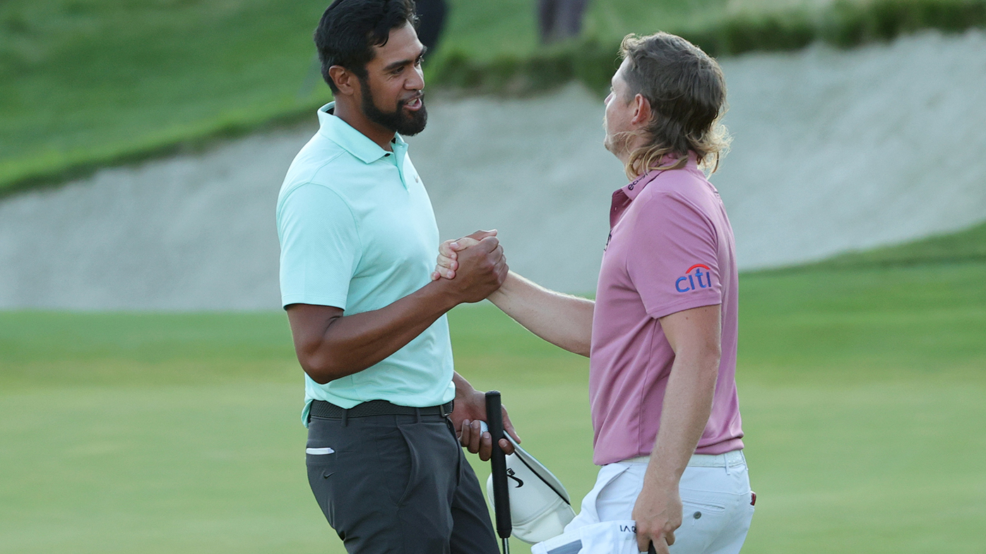 Cameron Smith (right) congratulates Tony Finau after the American took out the Northern Trust.