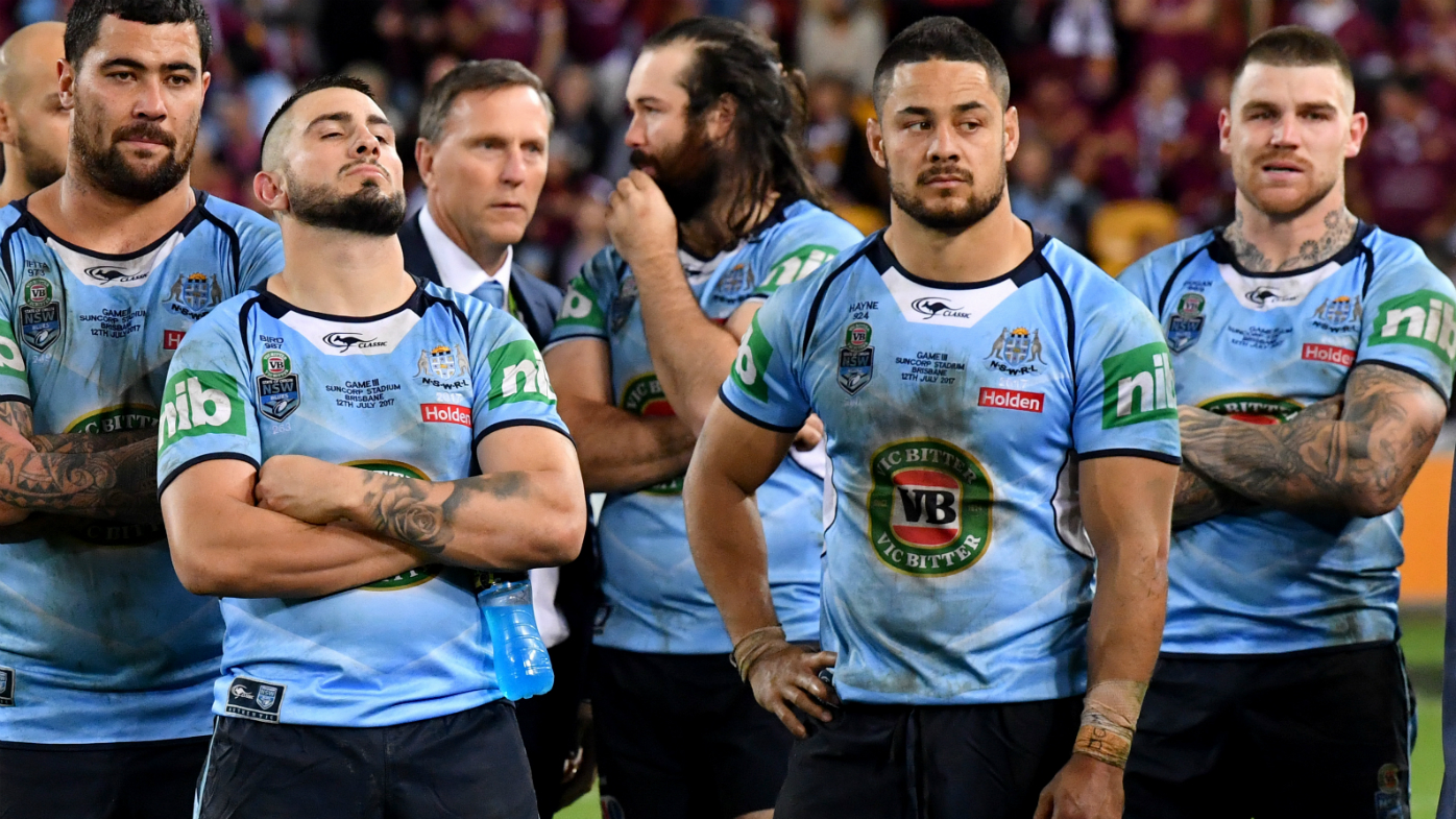 Dejected NSW players watch on