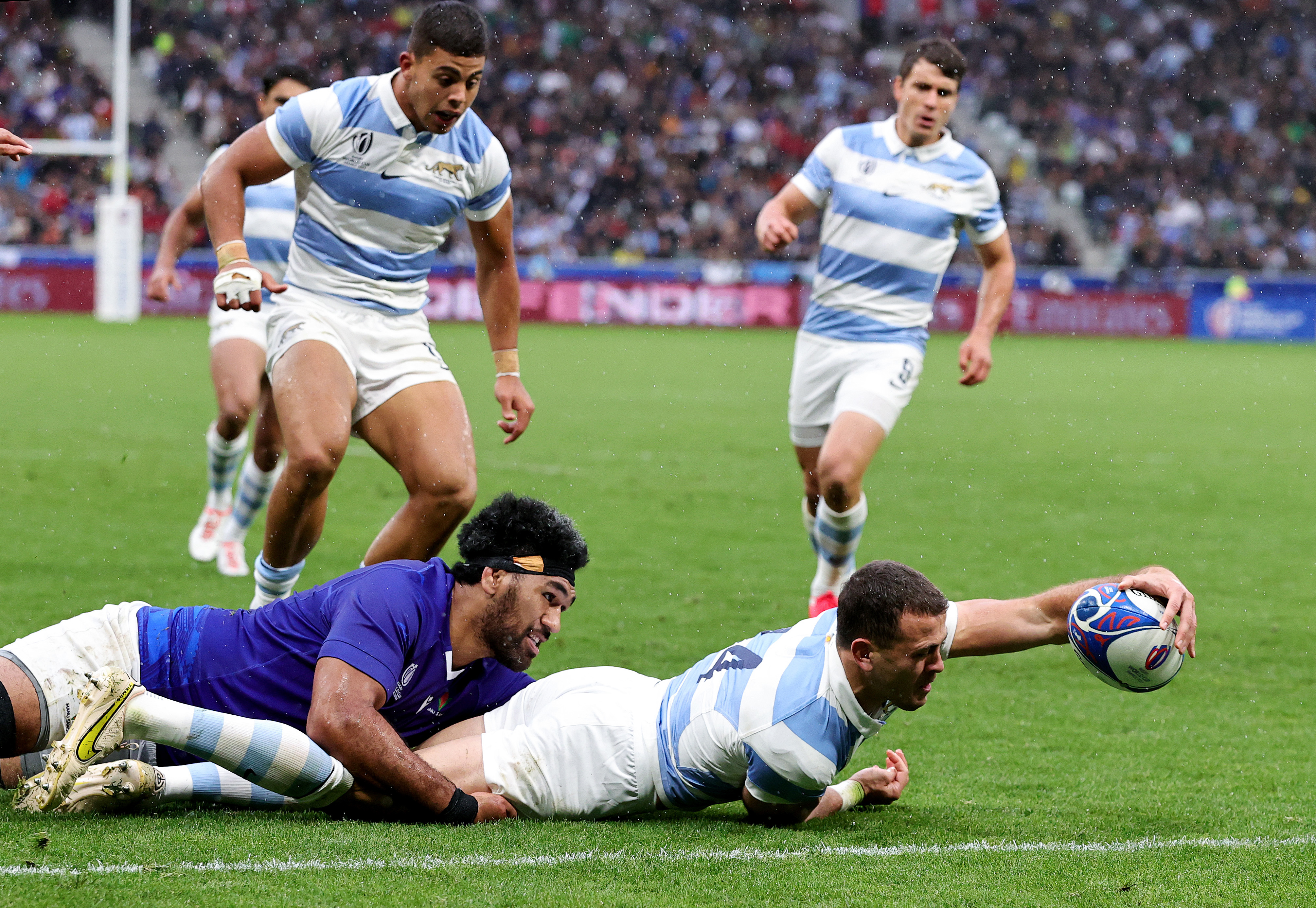 Emiliano Boffelli of Argentina scores his team's first try during the Rugby World Cup match against Samoa.