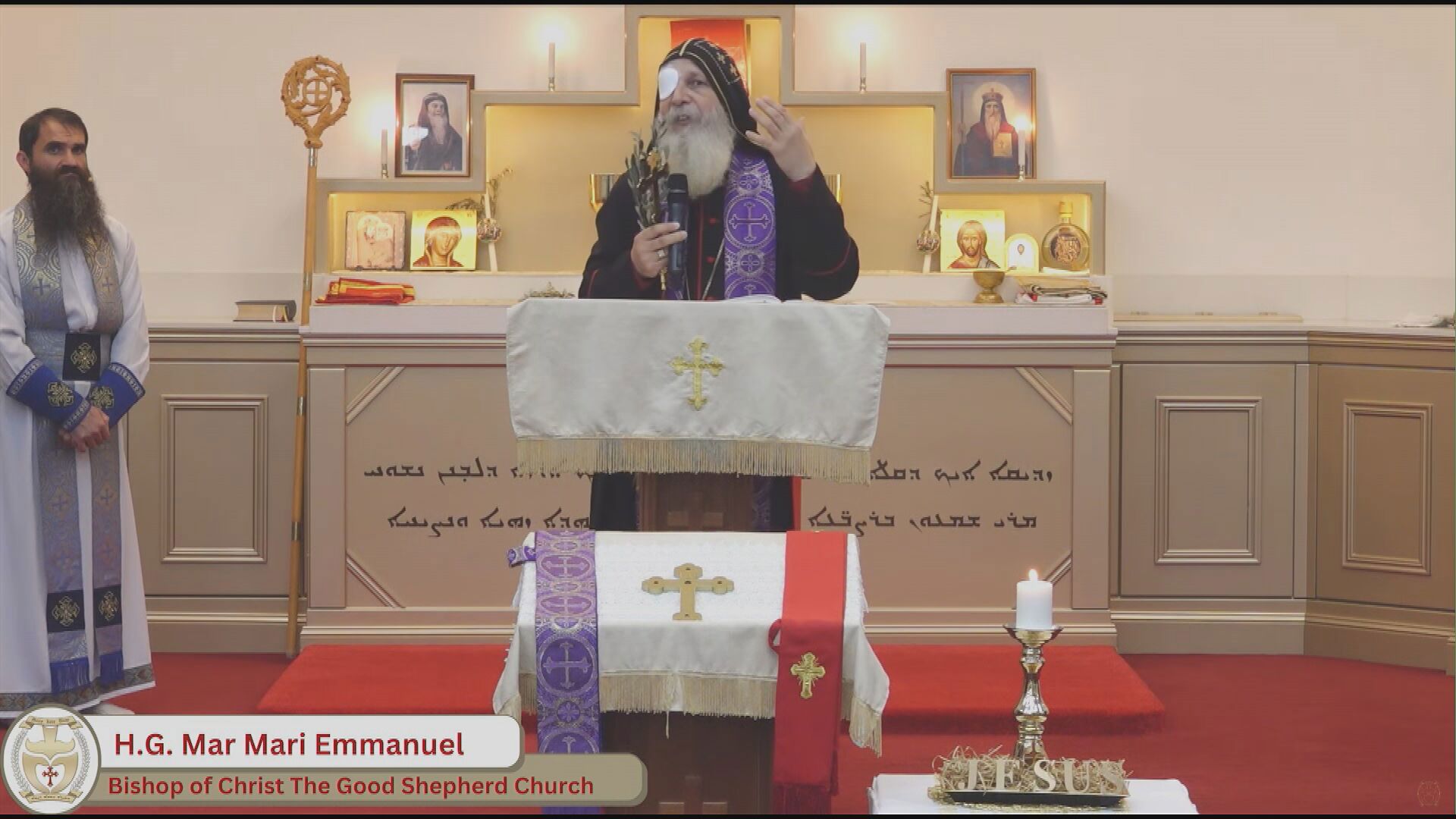 The Sydney bishop stabbed in an alleged terror attack two weeks ago has been given a standing ovation as he returned to the pulpit.