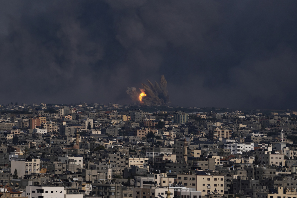 Fire and smoke rise following an Israeli airstrike, in Gaza City, Sunday, Oct. 8, 2023. The militant Hamas rulers of the Gaza Strip carried out an unprecedented, multi-front attack on Israel at daybreak Saturday, firing thousands of rockets as dozens of Hamas fighters infiltrated the heavily fortified border in several locations, killing hundreds and taking captives. Palestinian health officials reported scores of deaths from Israeli airstrikes in Gaza. (AP Photo/Fatima Shbair)