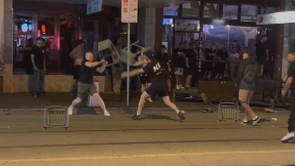 The two groups clashed and used metal chairs and umbrellas during the brawl after yesterday's Melbourne derby between Victory and City.