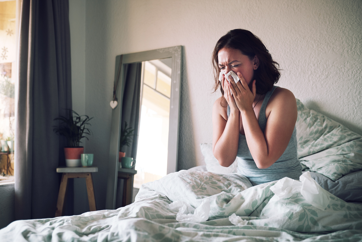 Woman in bed with flu