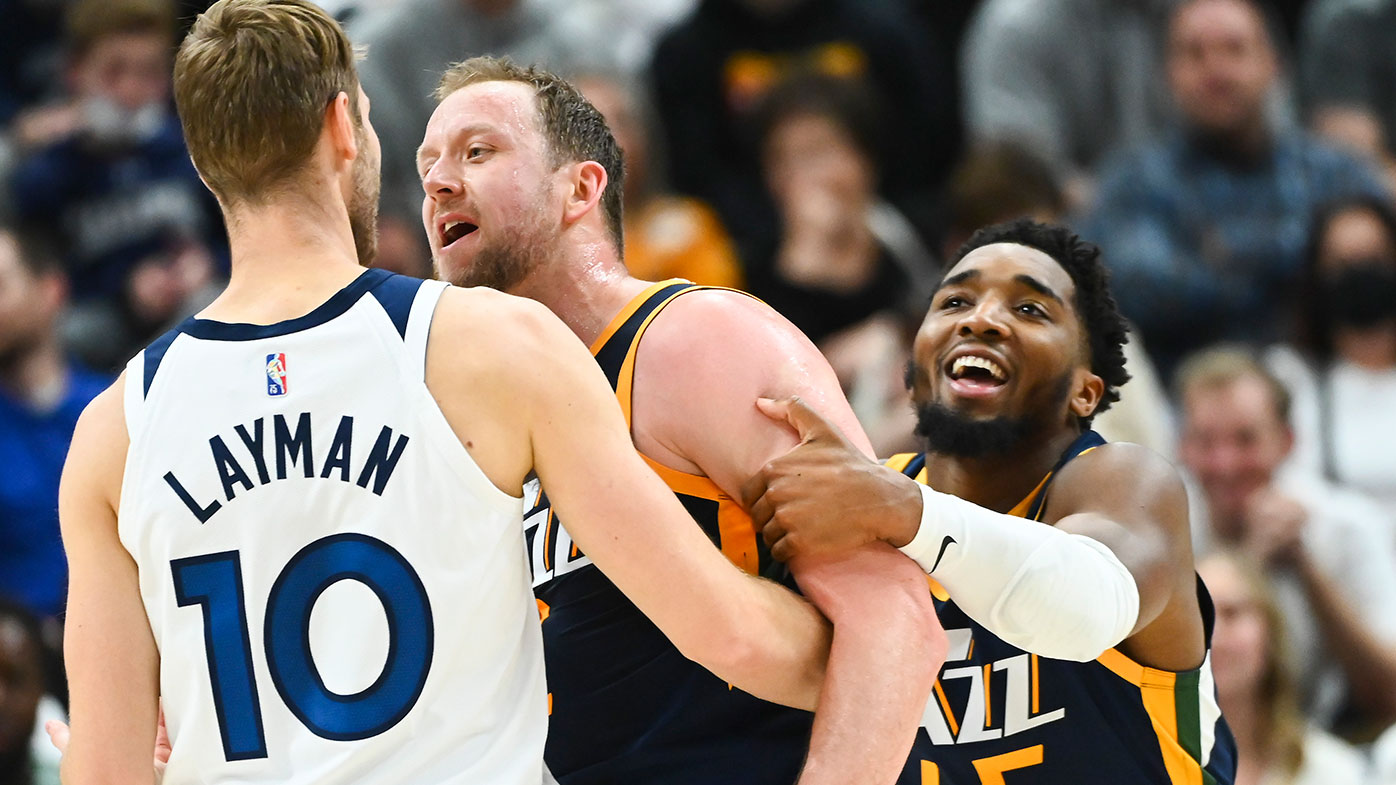  Donovan Mitchell #45 holds back Joe Ingles #2 of the Utah Jazz