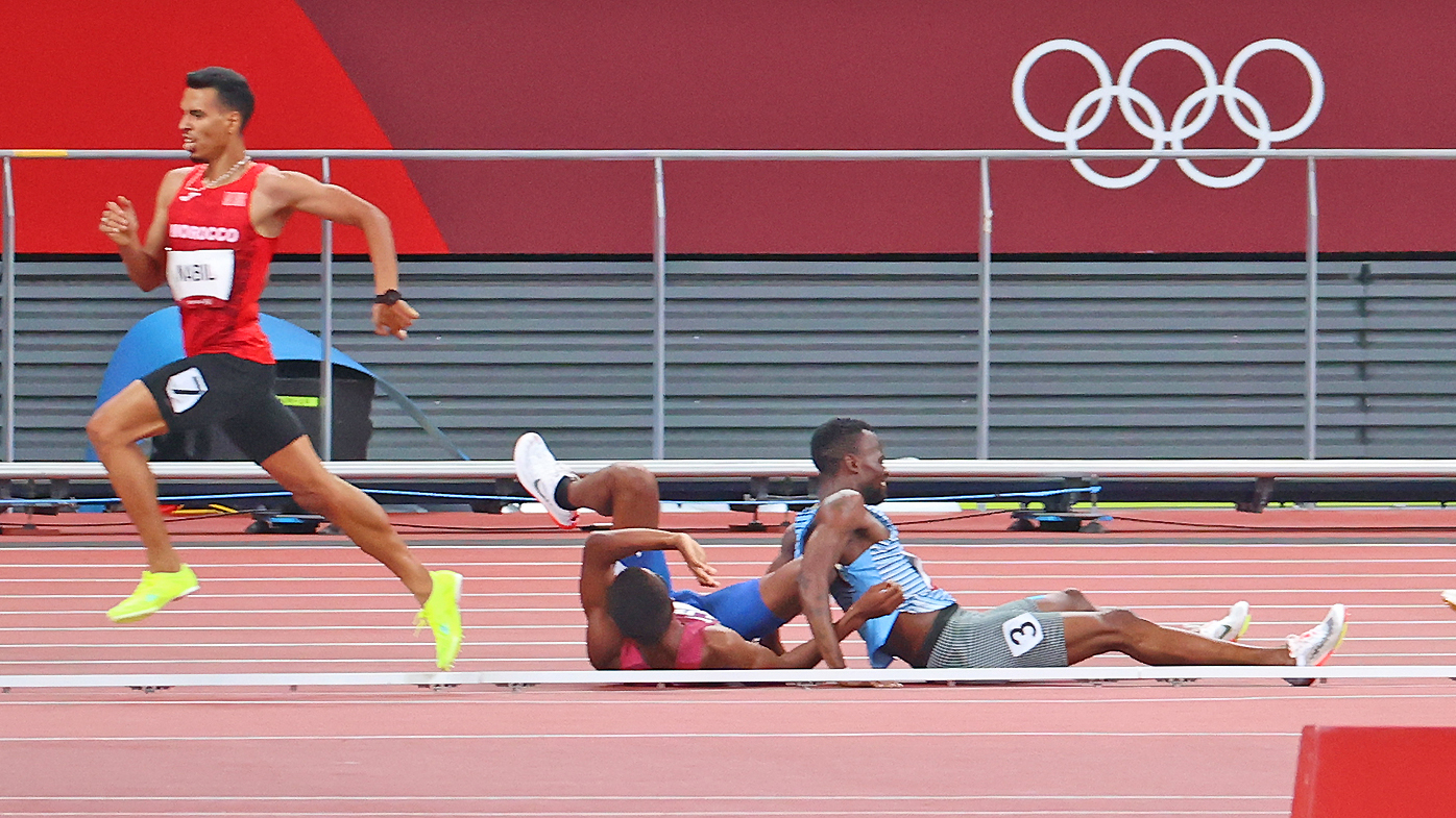  Isaiah Jewett of Team United States and Nijel Amos of Team Botswana lay on the ground after falling during the Men's 800m semifinal