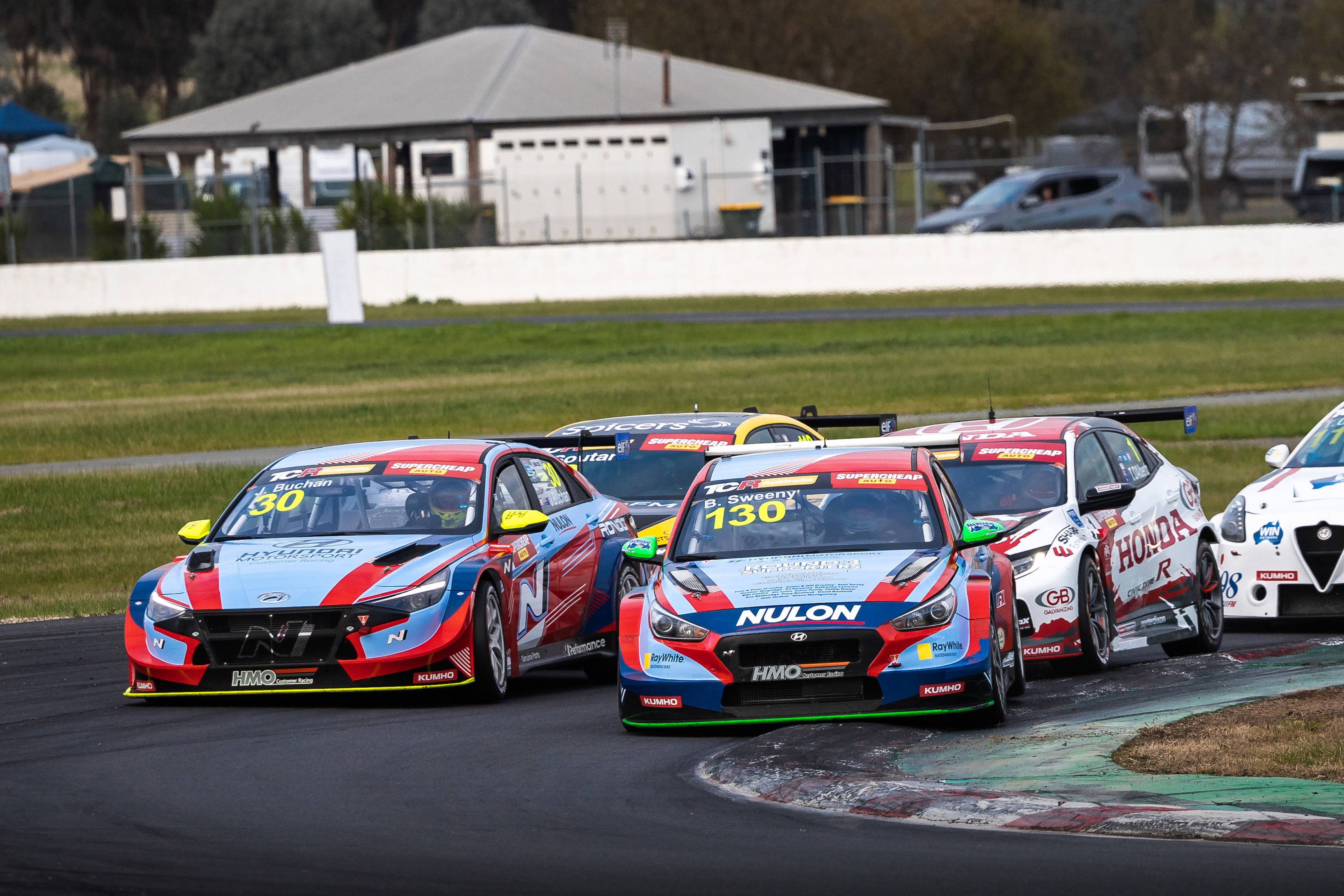Bailey Sweeny leads Josh Buchan into turn one at Winton Motor Raceway.