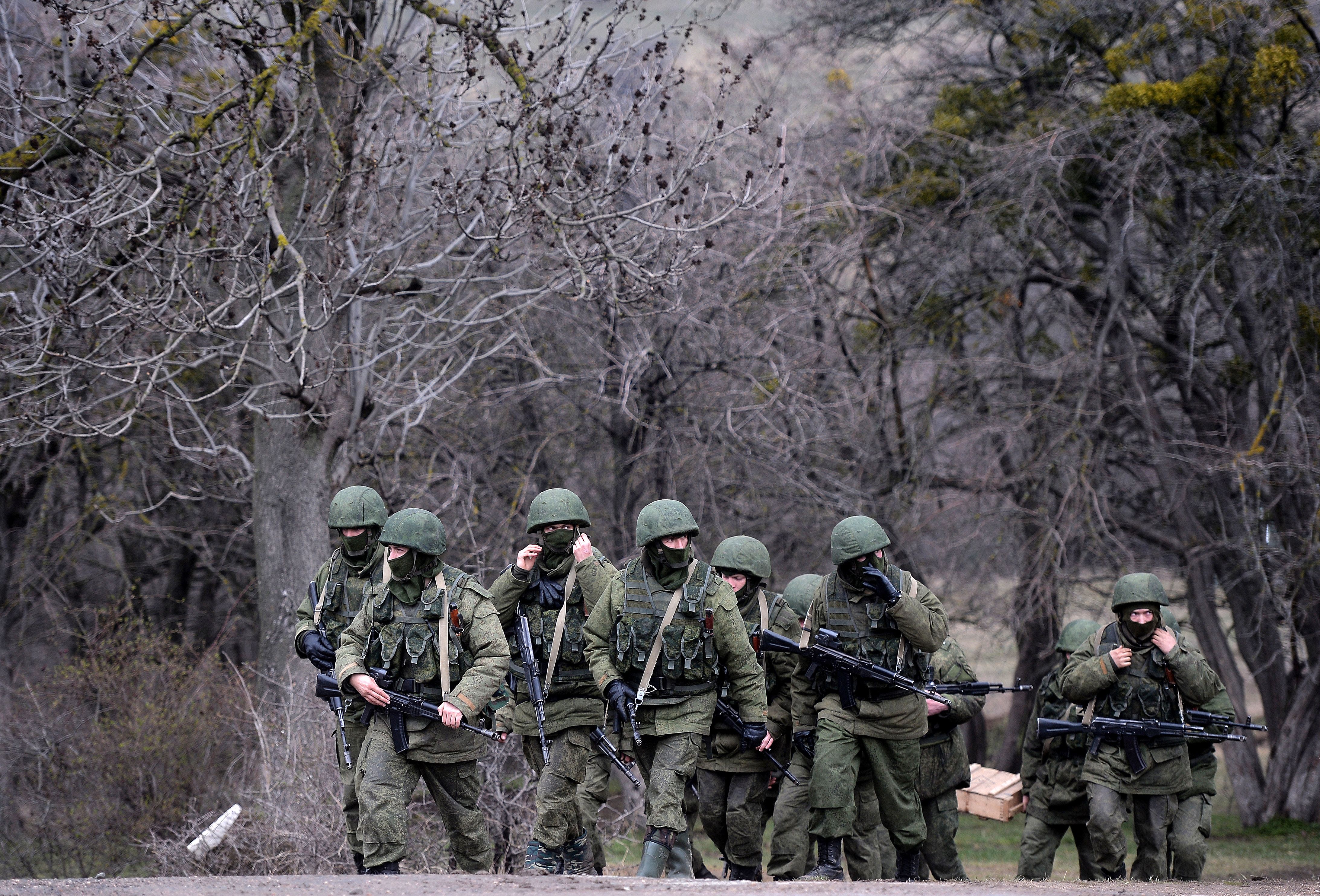 Russian soldiers patrol the area surrounding the Ukrainian military unit in Perevalnoye, outside Simferopol, on March 20, 2014