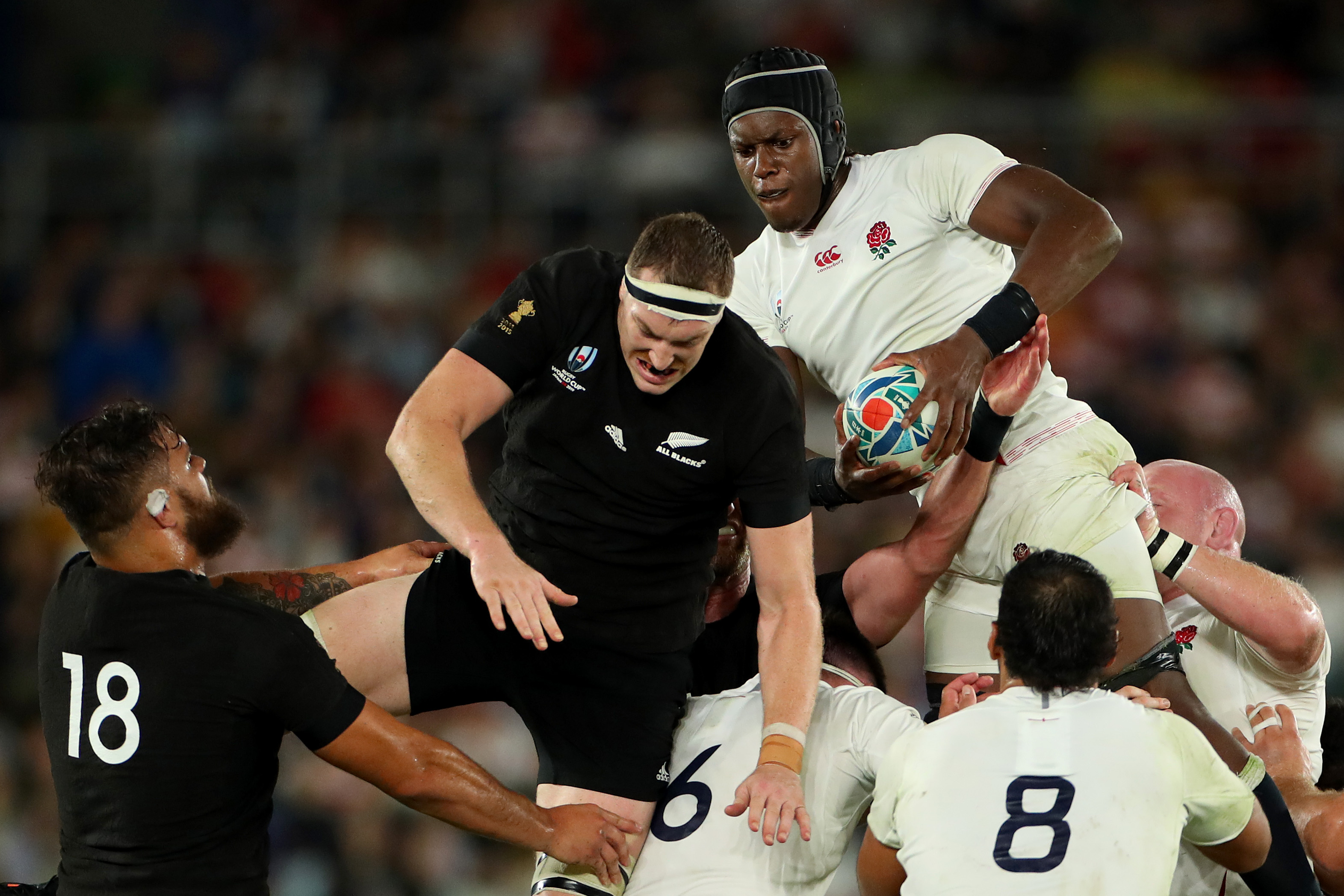 Maro Itoje of England wins lineout ball against Brodie Retallick of the All Blacks.