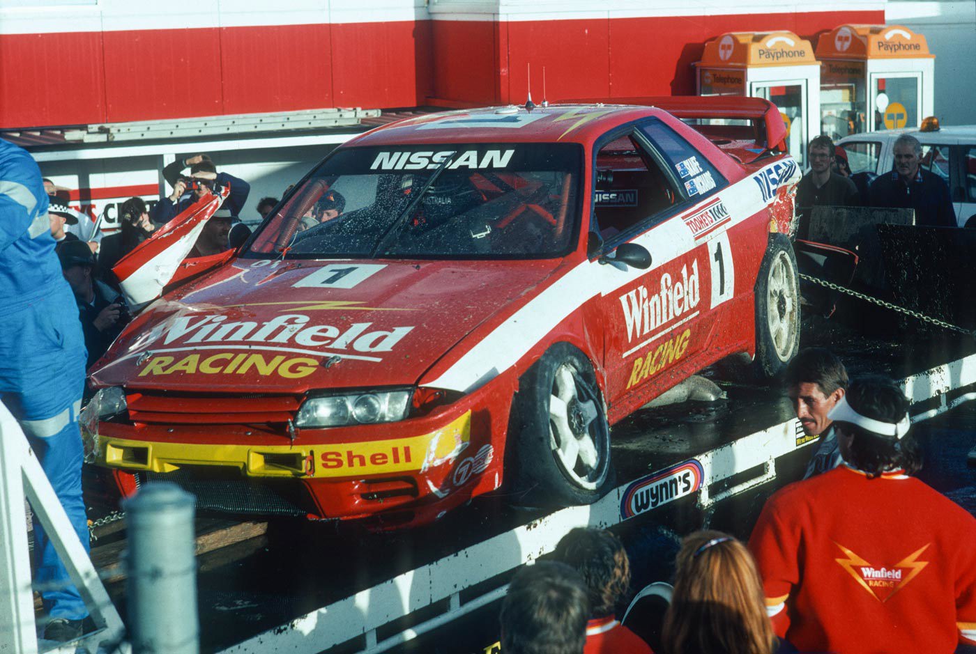 The wrecked Nissan Skyline R32 GT-R on the back of a flatbed truck after the 1992 Bathurst 1000.