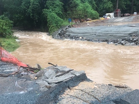 Floodwater has swallowed Flying Fox Bridge, Upper Coomera Road, south west of the Gold Coast.