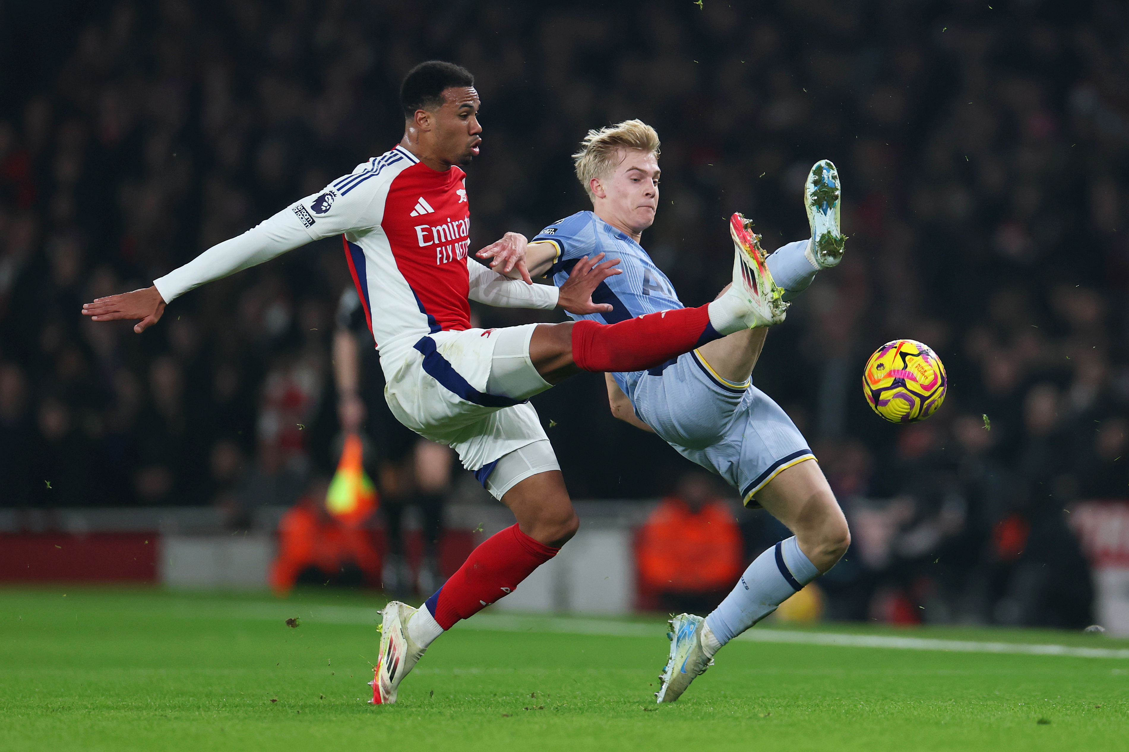 LONDON, ENGLAND - JANUARY 15: Gabriel of Arsenal and Lucas Bergvall of Tottenham Hotspur compete for the ball during the Premier League match between Arsenal FC and Tottenham Hotspur FC at Emirates Stadium on January 15, 2025 in London, England. (Photo by Alex Pantling/Getty Images)