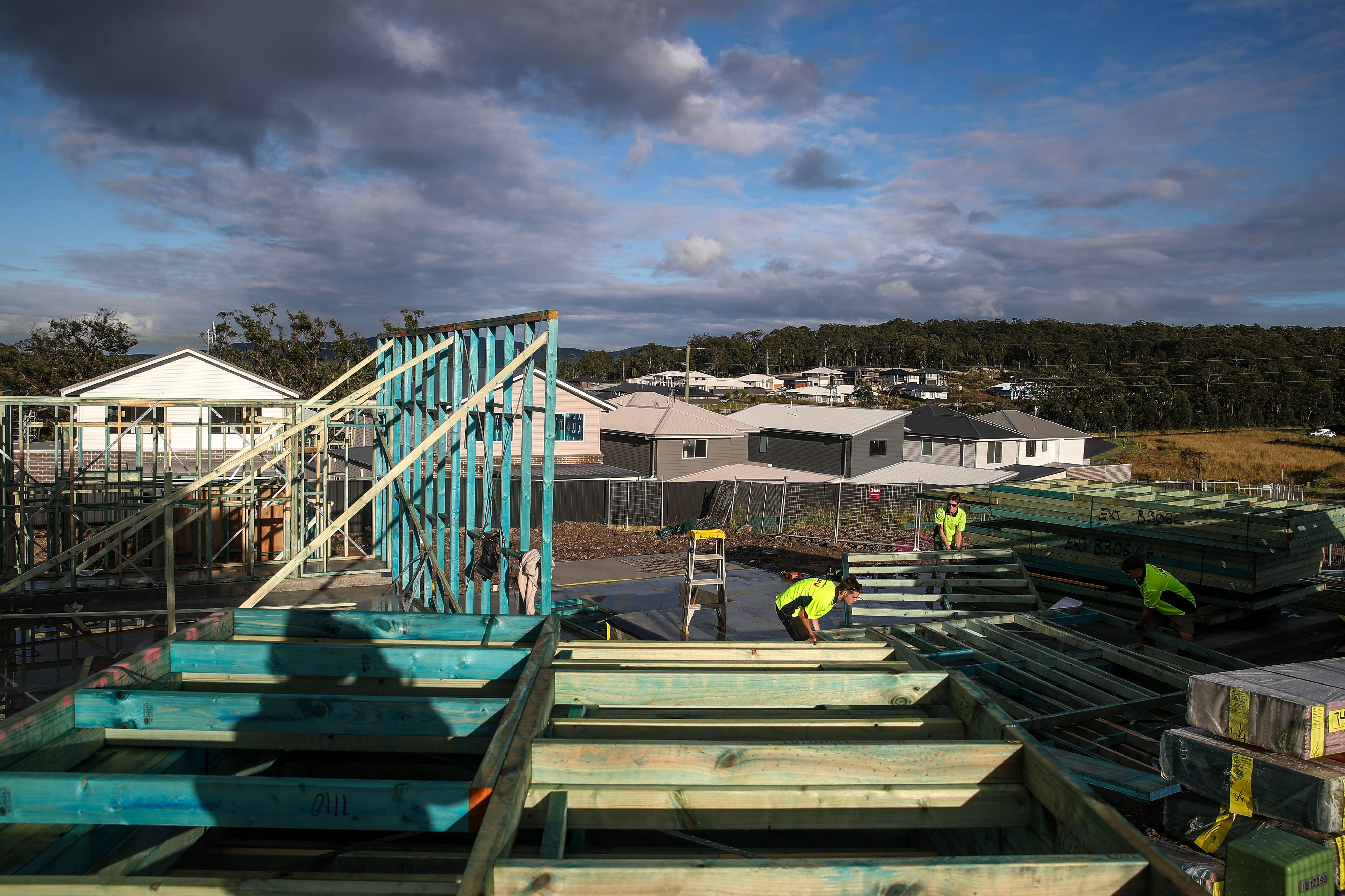 Workers labour on a building site